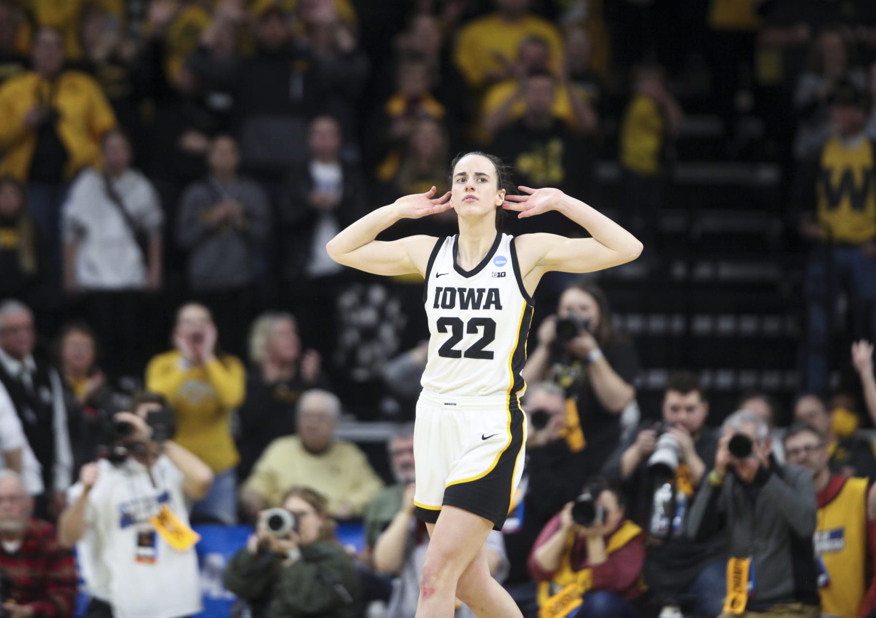 IOWA CITY, IOWA- MARCH 19:  Guard Caitlin Clark #22 of the Iowa Hawkeyes gestures to the crowd after a basket against the Georgia Lady Bulldogs late in the second half during the second round of the NCAA Women's Basketball Tournament at Carver-Hawkeye Arena on March 19, 2023 in Iowa City, Iowa.  (Photo by Matthew Holst/Getty Images)