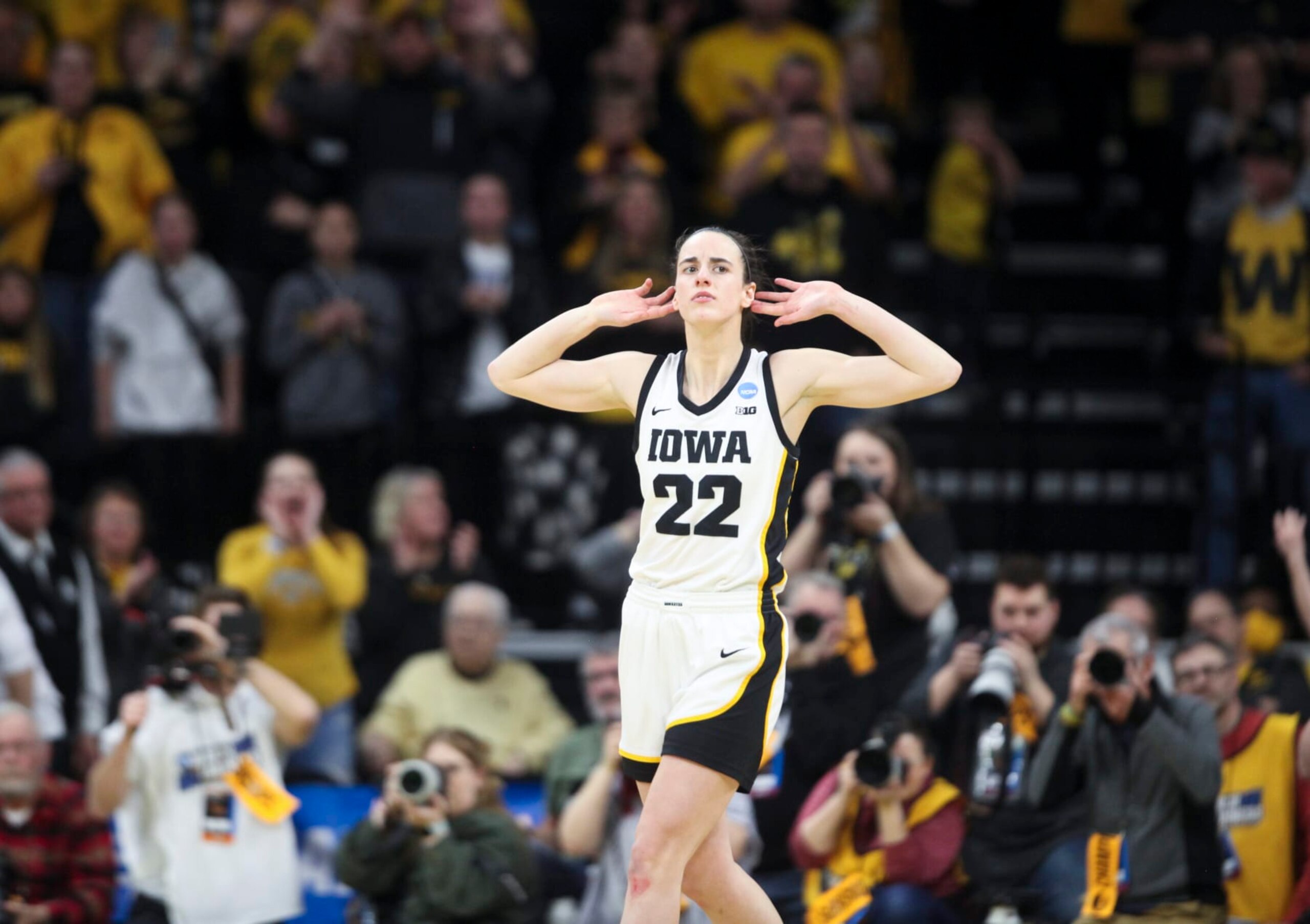 IOWA CITY, IOWA- MARCH 19:  Guard Caitlin Clark #22 of the Iowa Hawkeyes gestures to the crowd after a basket against the Georgia Lady Bulldogs late in the second half during the second round of the NCAA Women's Basketball Tournament at Carver-Hawkeye Arena on March 19, 2023 in Iowa City, Iowa.  (Photo by Matthew Holst/Getty Images)
