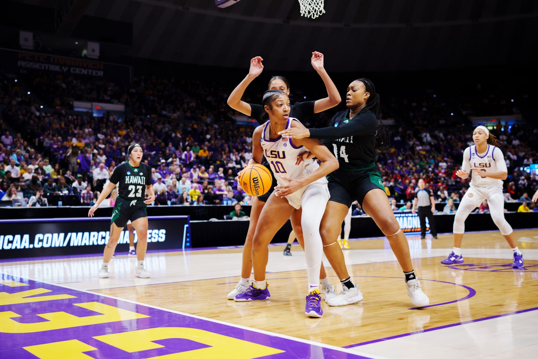 BATON ROUGE, LA - MARCH 17: Angel Reese #10 of the LSU Lady Tigers fights for position against Nnenna Orji #14 of the Hawai'i Rainbow Wahine during the first quarter in the first round of the 2023 NCAA Women's Basketball Tournament held at the Pete Maravich Assembly Center on March 17, 2023 in Baton Rouge, Louisiana. (Photo by Rebecca Warren/NCAA Photos via Getty Images)