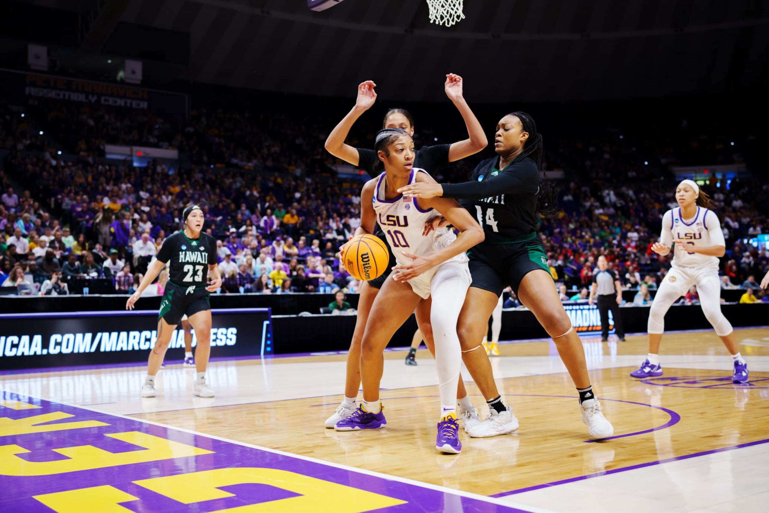 BATON ROUGE, LA - MARCH 17: Angel Reese #10 of the LSU Lady Tigers fights for position against Nnenna Orji #14 of the Hawai'i Rainbow Wahine during the first quarter in the first round of the 2023 NCAA Women's Basketball Tournament held at the Pete Maravich Assembly Center on March 17, 2023 in Baton Rouge, Louisiana. (Photo by Rebecca Warren/NCAA Photos via Getty Images)