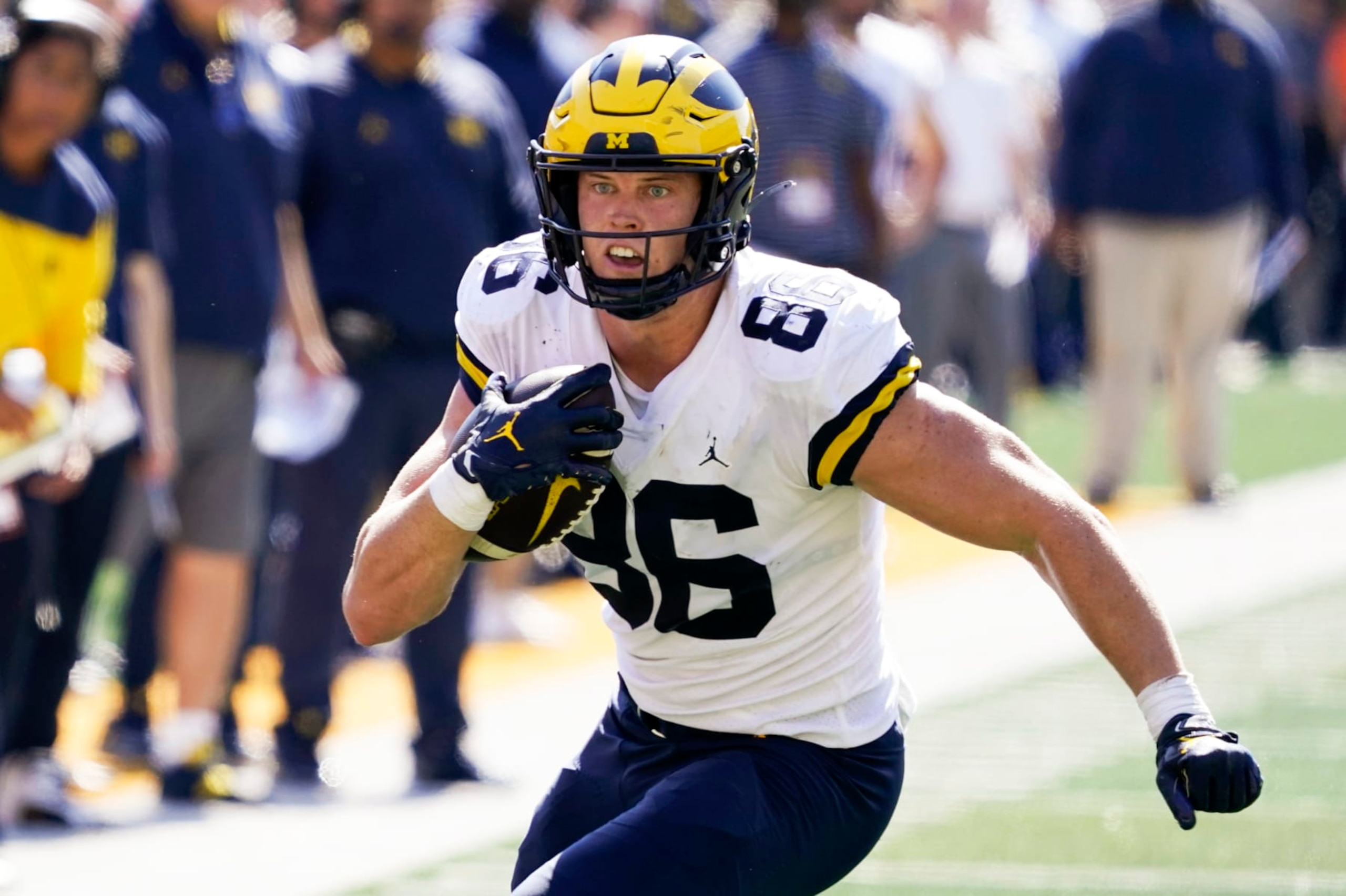 Michigan tight end Luke Schoonmaker (86) runs up field after catching a pass during the second half of an NCAA college football game against Iowa, Saturday, Oct. 1, 2022, in Iowa City, Iowa. Michigan won 27-14. (AP Photo/Charlie Neibergall)