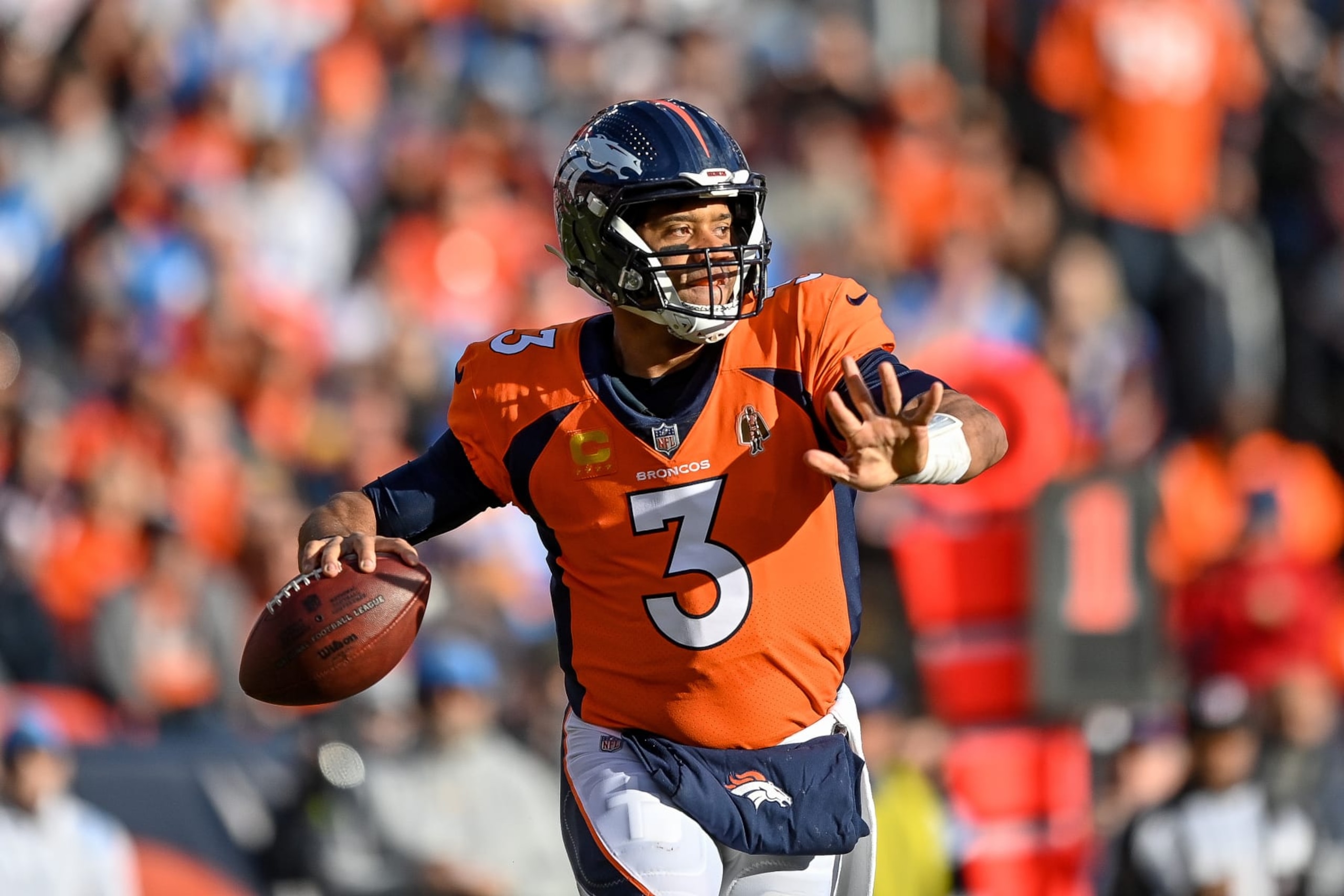 DENVER, CO - JANUARY 8: Denver Broncos quarterback Russell Wilson (3) passes in the first quarter during a game between the Los Angeles Chargers and the Denver Broncos at Empower Field at Mile High on January 8, 2023 in Denver, Colorado. (Photo by Dustin Bradford/Icon Sportswire via Getty Images)