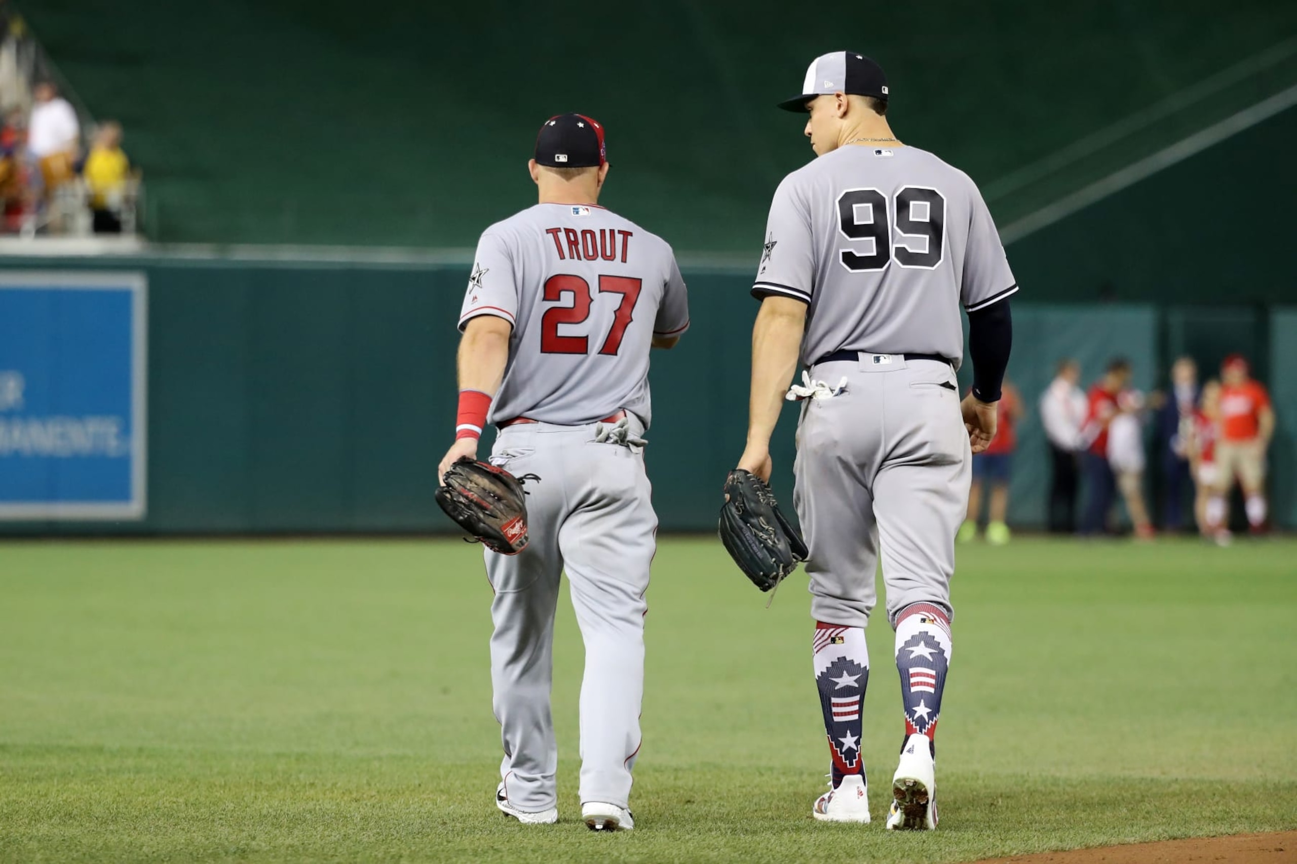 WASHINGTON, DC - JULY 17:  Mike Trout #27 of the Los Angeles Angels of Anaheim and the American League and Aaron Judge #99 of the New York Yankees and the American League take the field in the sixth inning against the National League during the 89th MLB All-Star Game, presented by Mastercard at Nationals Park on July 17, 2018 in Washington, DC.  (Photo by Rob Carr/Getty Images)