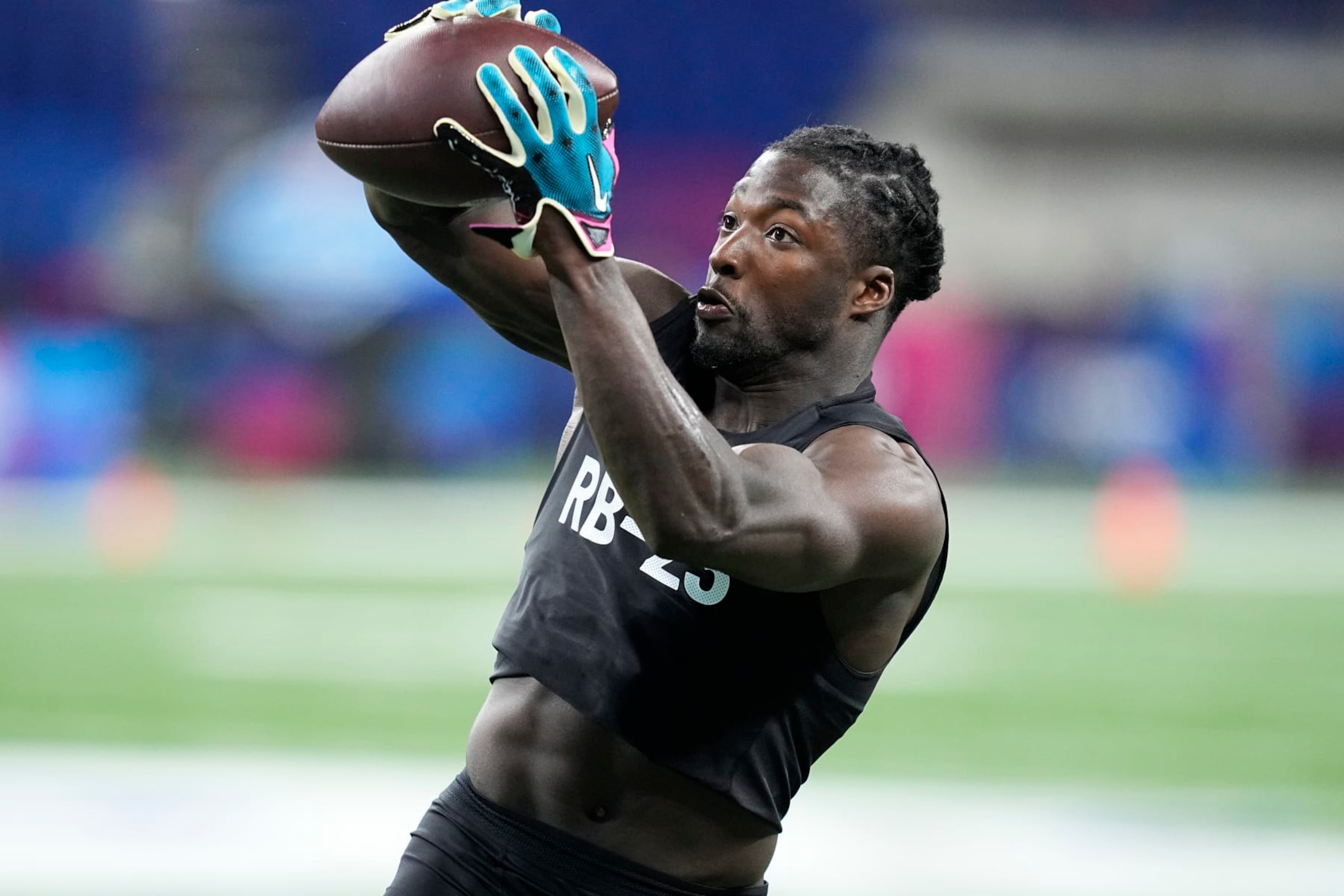 Tulane running back Tyjae Spears runs a drill at the NFL football scouting combine in Indianapolis, Sunday, March 5, 2023. (AP Photo/Darron Cummings)