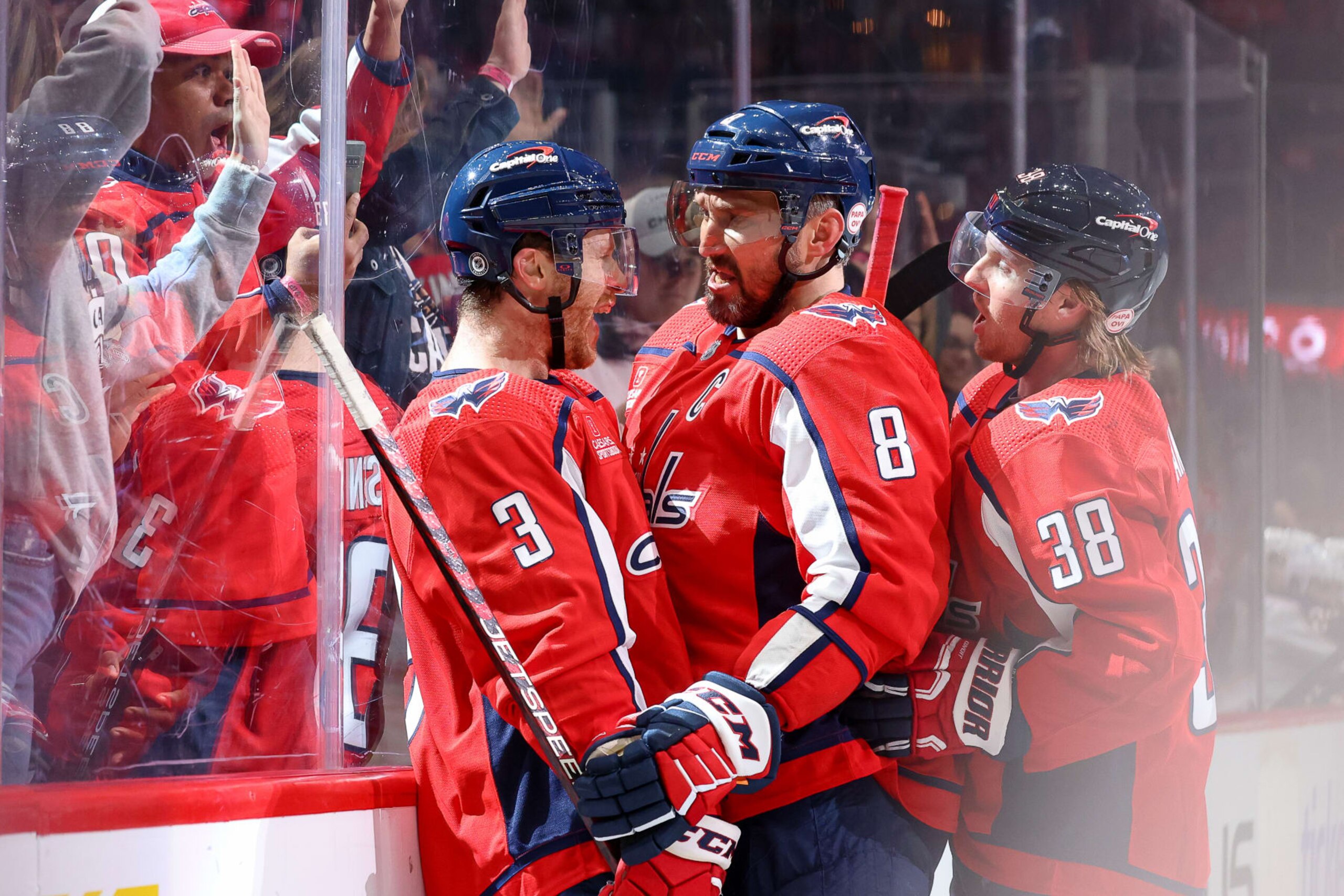 WASHINGTON, DC - MARCH 21: Nick Jensen #3 of the Washington Capitals celebrates a third period goal with Alex Ovechkin #8 and Rasmus Sandin #38 during a game between against the Columbus Blue Jackets at Capital One Arena on March 21, 2023 in Washington, D.C. (Photo by John McCreary/NHLI via Getty Images)