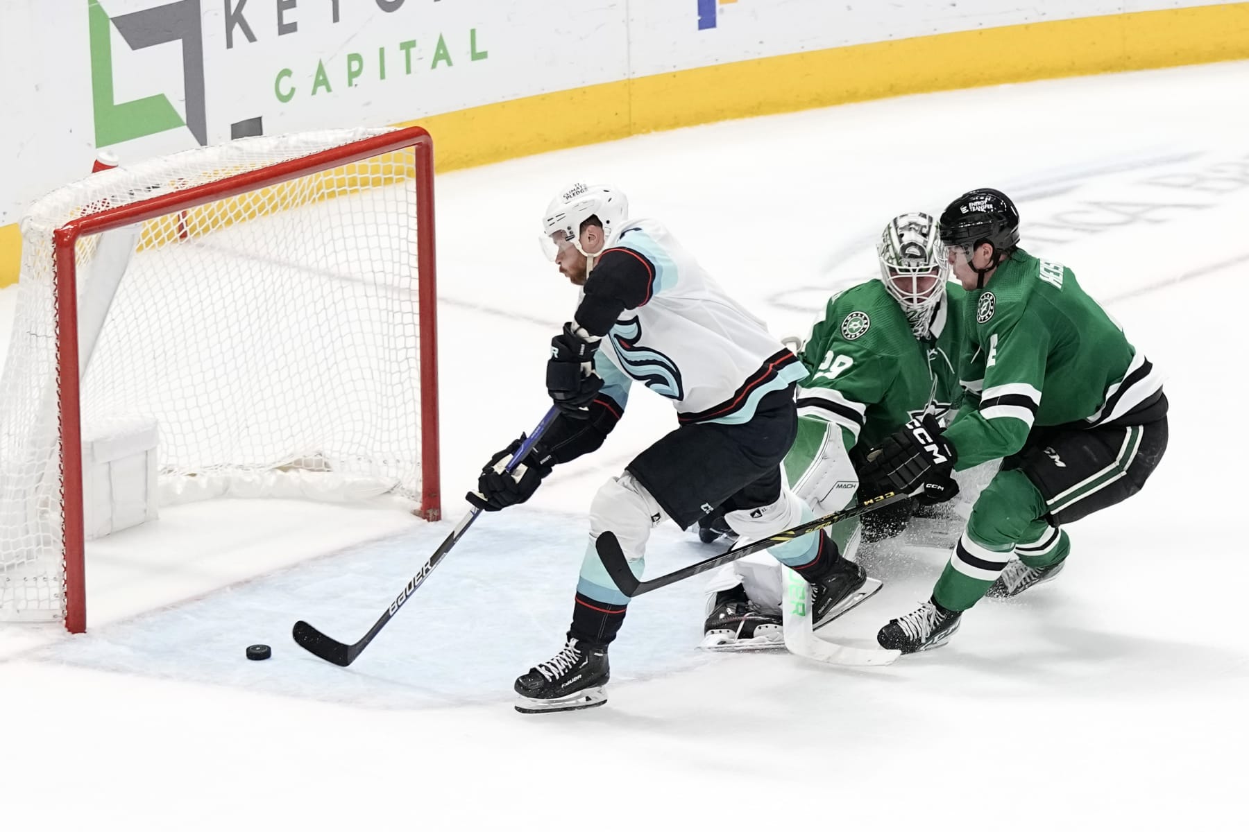 DALLAS, TEXAS - MARCH 21: Adam Larsson #6 of the Seattle Kraken scores the game-winning goal during overtime past Jake Oettinger #29 of the Dallas Stars at American Airlines Center on March 21, 2023 in Dallas, Texas. (Photo by Sam Hodde/NHLI via Getty Images)