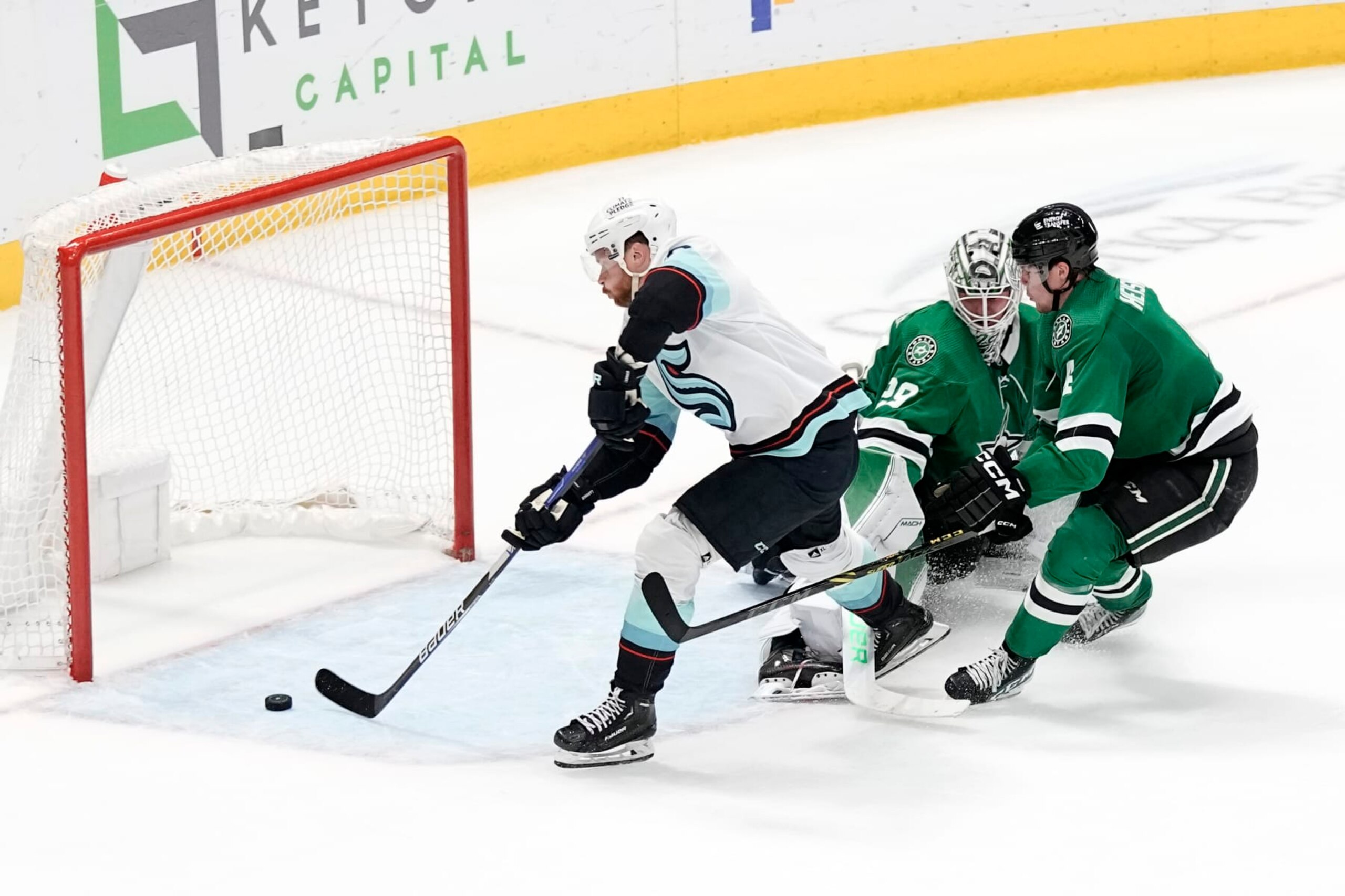 DALLAS, TEXAS - MARCH 21: Adam Larsson #6 of the Seattle Kraken scores the game-winning goal during overtime past Jake Oettinger #29 of the Dallas Stars at American Airlines Center on March 21, 2023 in Dallas, Texas. (Photo by Sam Hodde/NHLI via Getty Images)