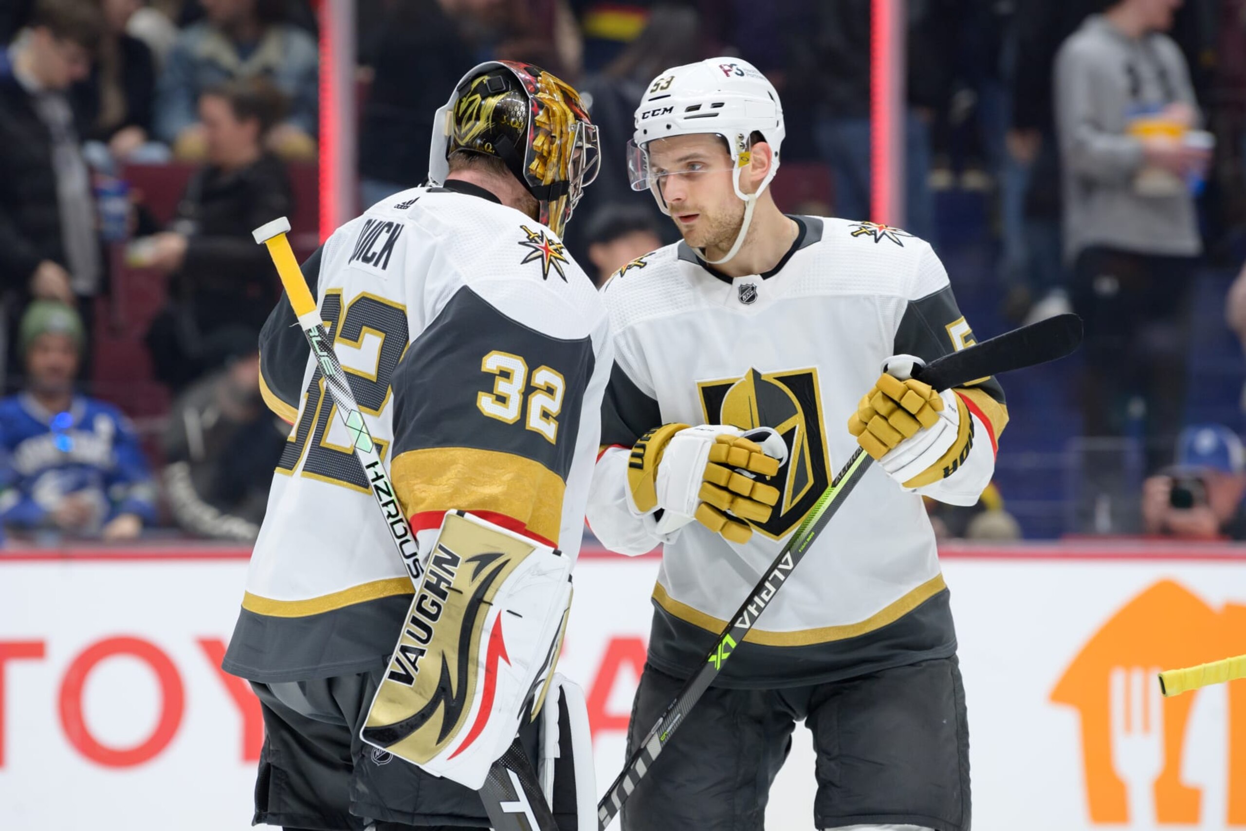 VANCOUVER, CANADA - MARCH 21: Jonathan Quick #32 and Teddy Blueger #53 of the Vegas Golden Knights celebrate after defeating the Vancouver Canucks during their NHL game at Rogers Arena on March 21, 2023 in Vancouver, British Columbia, Canada. (Photo by Derek Cain/Getty Images)