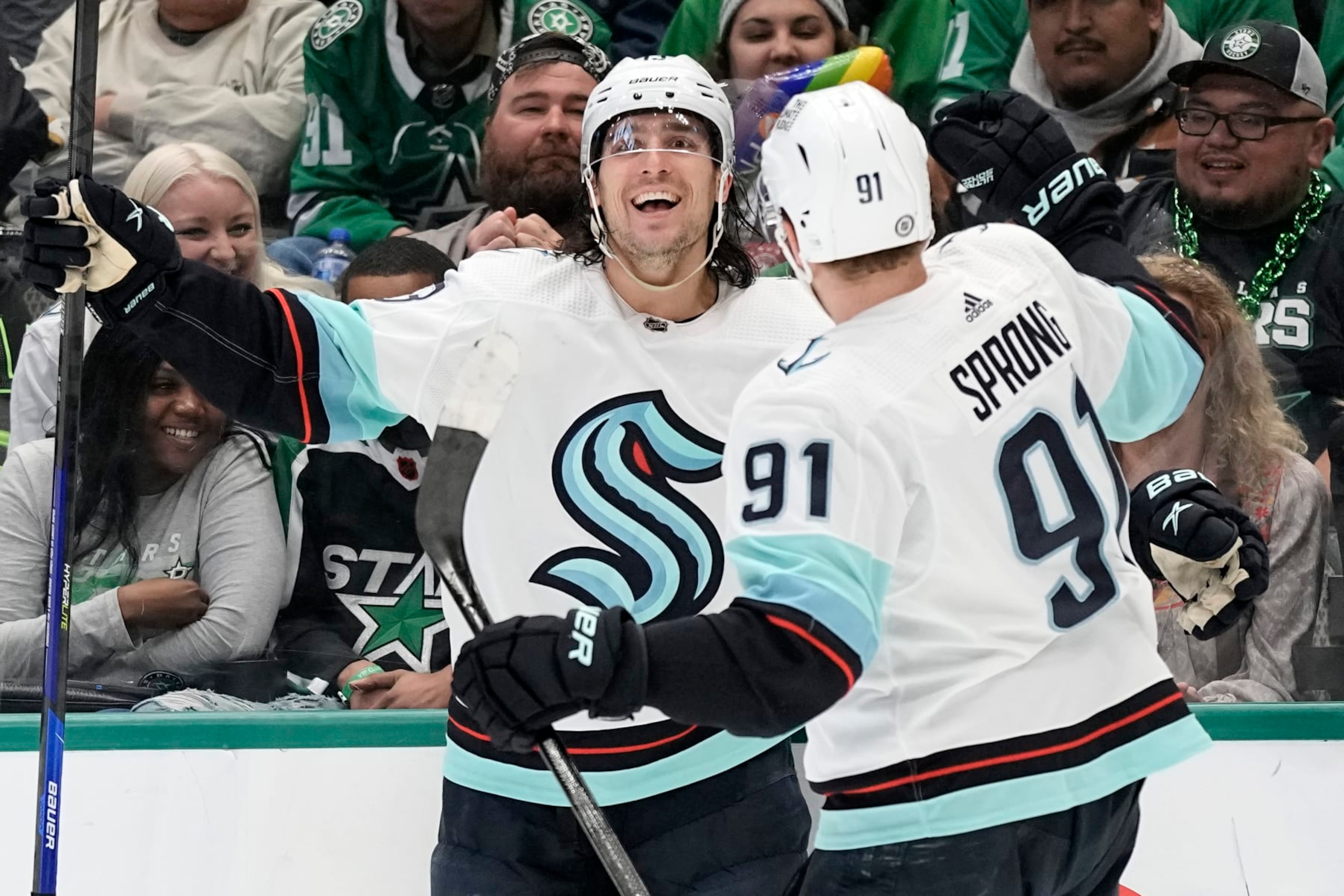 DALLAS, TEXAS - MARCH 21: Brandon Tanev #13 of the Seattle Kraken celebrates with teammate Daniel Sprong #91 after scoring a goal during the second period against the Dallas Stars at American Airlines Center on March 21, 2023 in Dallas, Texas. (Photo by Sam Hodde/NHLI via Getty Images)