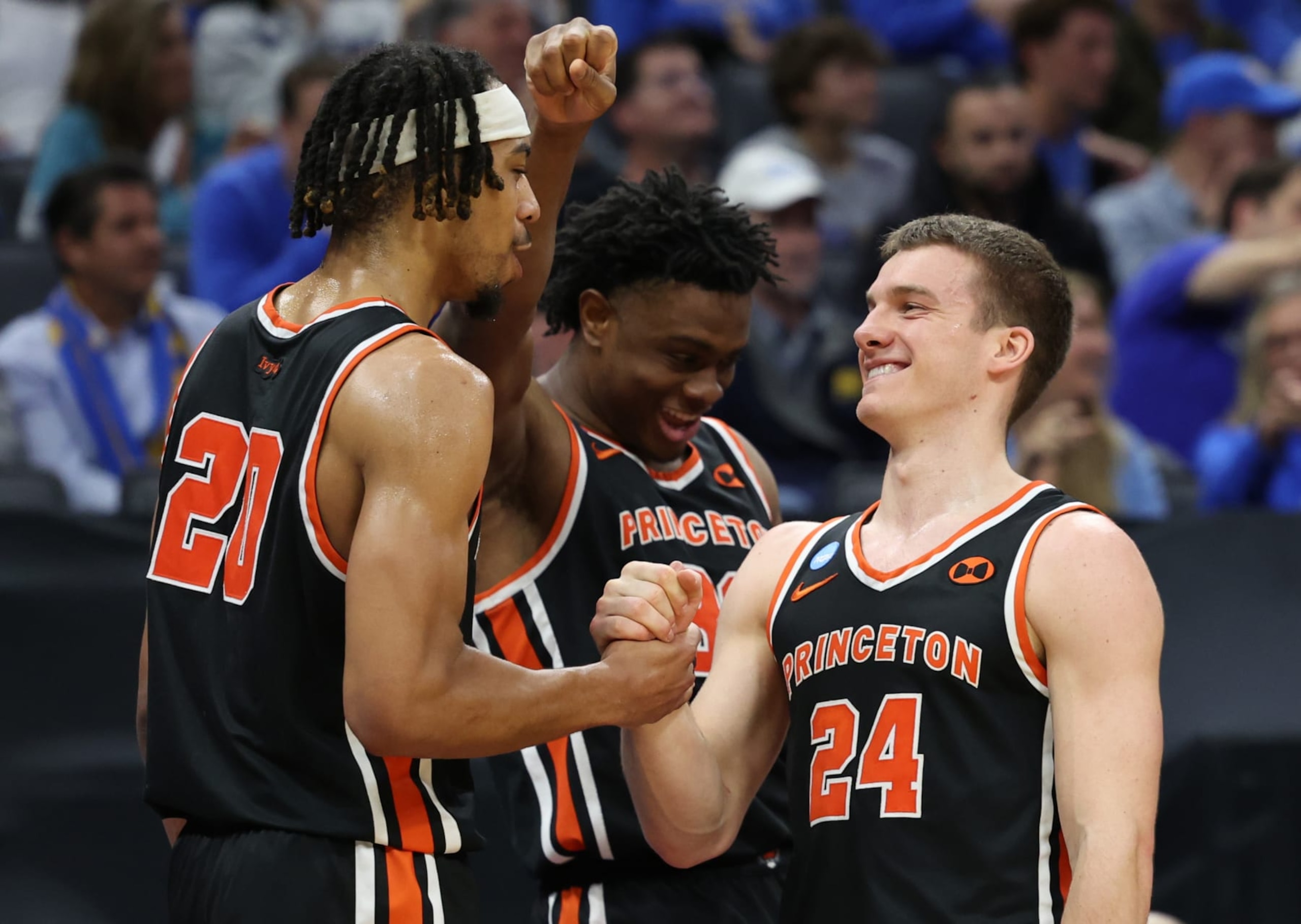 SACRAMENTO, CALIFORNIA - MARCH 18: Blake Peters #24, Tosan Evbuomwan #20, and Keeshawn Kellman #32 of the Princeton Tigers react on the bench during the second half against the Missouri Tigers in the second round of the NCAA Men's Basketball Tournament at Golden 1 Center on March 18, 2023 in Sacramento, California. (Photo by Ezra Shaw/Getty Images)