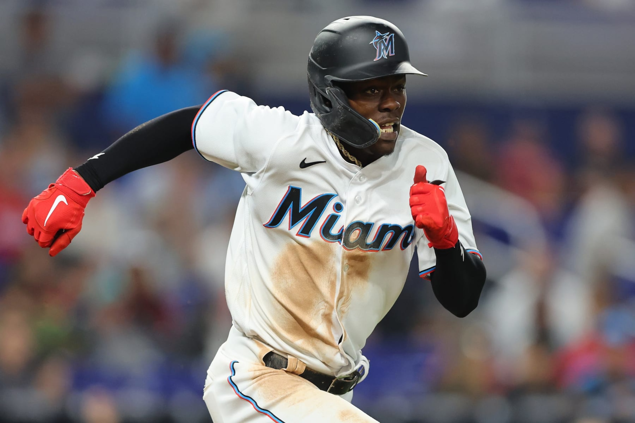 MIAMI, FLORIDA - JUNE 09: Jazz Chisholm Jr. #2 of the Miami Marlins runs to first after bunting for a single against the Washington Nationals at loanDepot park on June 09, 2022 in Miami, Florida. (Photo by Michael Reaves/Getty Images)