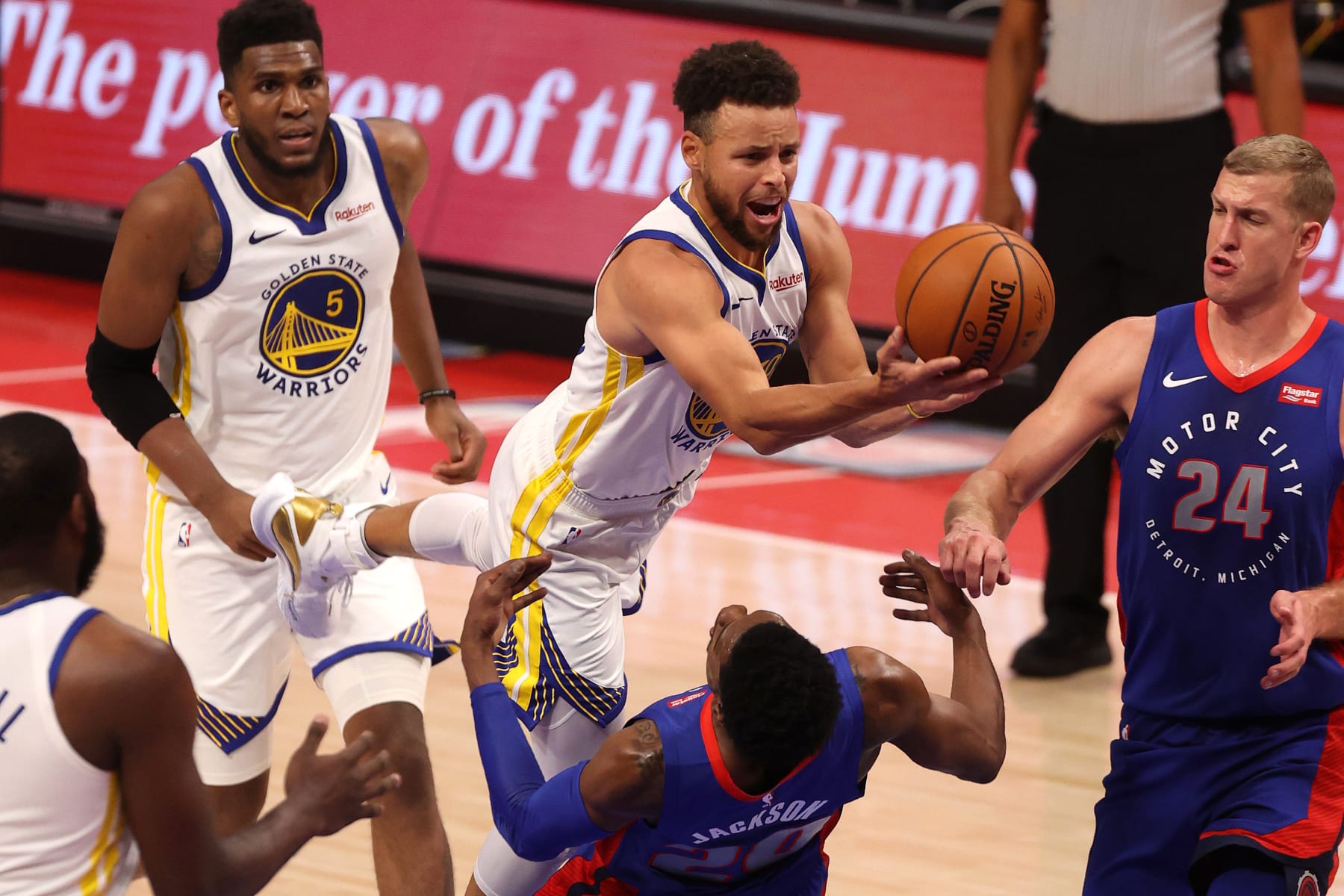 DETROIT, MICHIGAN - DECEMBER 29: Stephen Curry #30 of the Golden State Warriors tries to get to the basket past Josh Jackson #20 of the Detroit Pistons during the first half at Little Caesars Arena on December 29, 2020 in Detroit, Michigan. NOTE TO USER: User expressly acknowledges and agrees that, by downloading and or using this photograph, User is consenting to the terms and conditions of the Getty Images License Agreement. (Photo by Gregory Shamus/Getty Images)