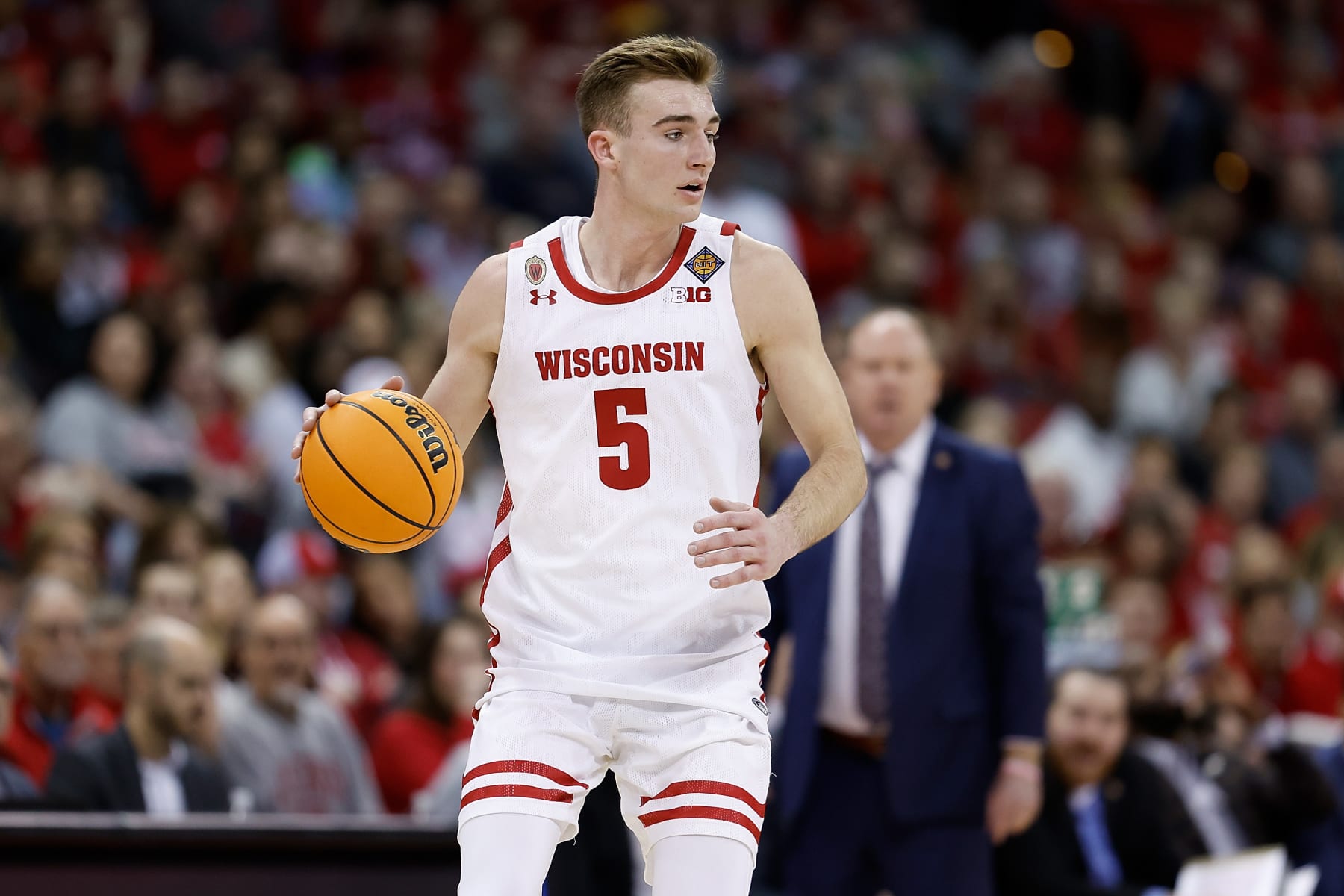 MADISON, WISCONSIN - MARCH 19: Tyler Wahl #5 of the Wisconsin Badgers dribbles up court during the first half of the game against the Liberty Flames in the second round of the NIT Men's Basketball Tournament at Kohl Center on March 19, 2023 in Madison, Wisconsin. (Photo by John Fisher/Getty Images)