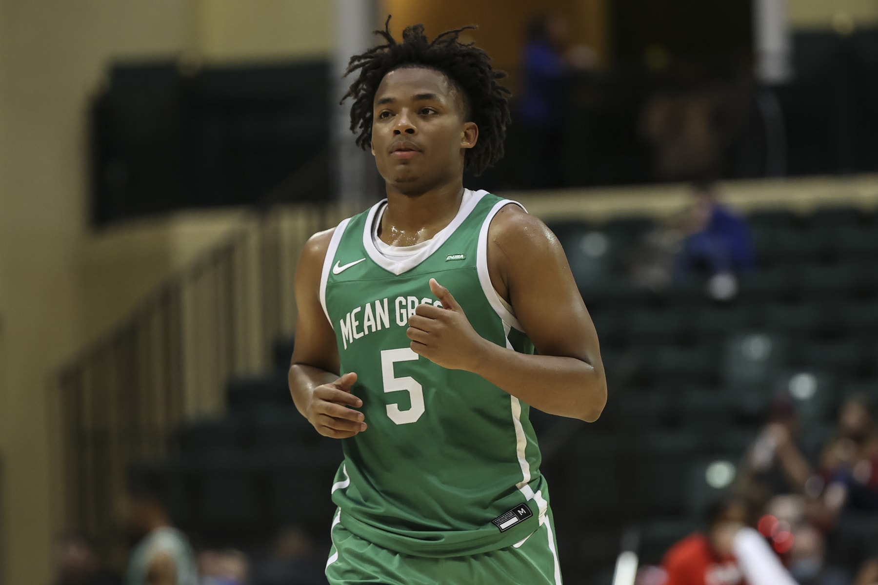 ORLANDO, FL - NOVEMBER 25: North Texas Mean Green guard Tylor Perry (5) during the ESPN Events Invitational college basketball game between the North Texas Mean Green and Kansas Jayhawks on November 25, 2021 at the HP Field House in Orlando, FL. (Photo by Mark LoMoglio/Icon Sportswire via Getty Images)