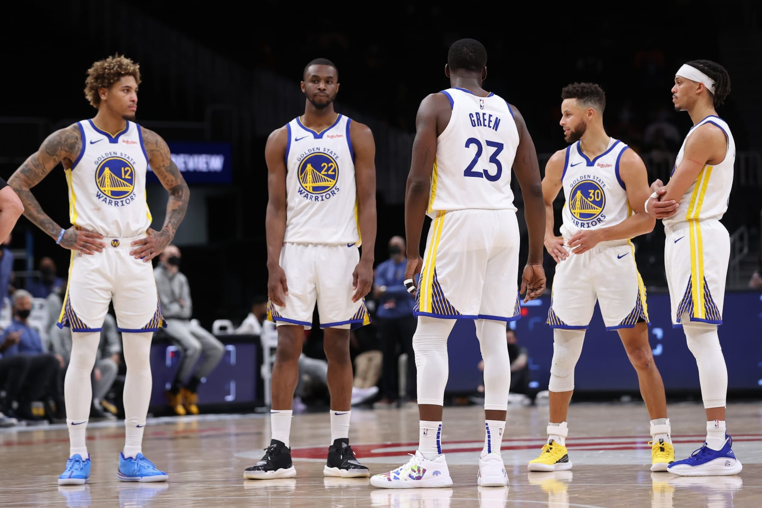 ATLANTA, GA - APRIL 4: Draymond Green #23 of the Golden State Warriors talks with Kelly Oubre Jr. #12, Andrew Wiggins #22, Stephen Curry #30, and Damion Lee #1 during the game against the Atlanta Hawks on April 4, 2021 at State Farm Arena in Atlanta, Georgia.  NOTE TO USER: User expressly acknowledges and agrees that, by downloading and/or using this Photograph, user is consenting to the terms and conditions of the Getty Images License Agreement. Mandatory Copyright Notice: Copyright 2021 NBAE (Photo by Joe Murphy/NBAE via Getty Images)