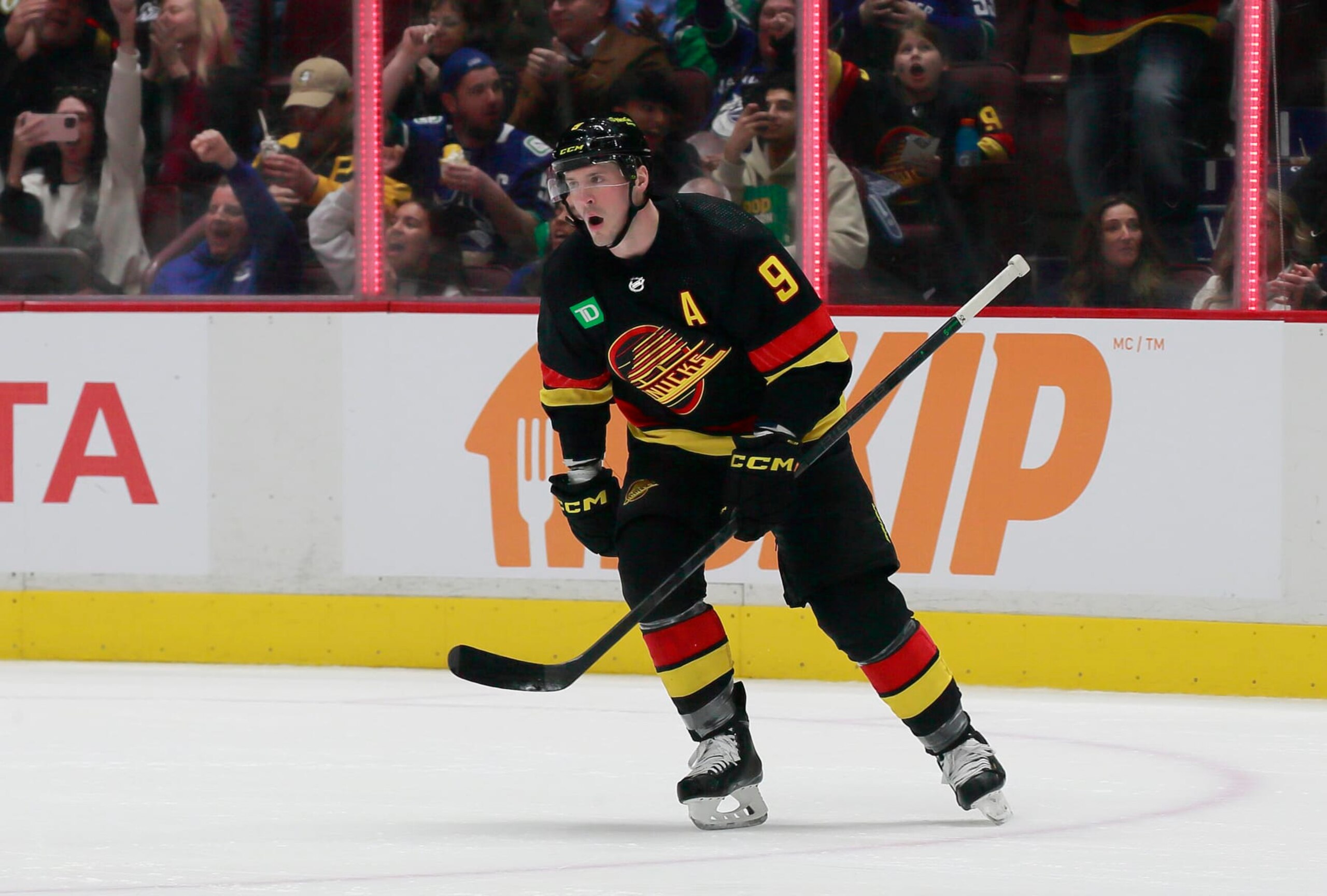 VANCOUVER, CANADA - MARCH 21: J.T. Miller #9 of the Vancouver Canucks reacts after scoring on a penalty shot goal during the second period of their NHL game against the Vegas Golden Knights at Rogers Arena March 21, 2023 in Vancouver, British Columbia, Canada.  (Photo by Jeff Vinnick/NHLI via Getty Images)