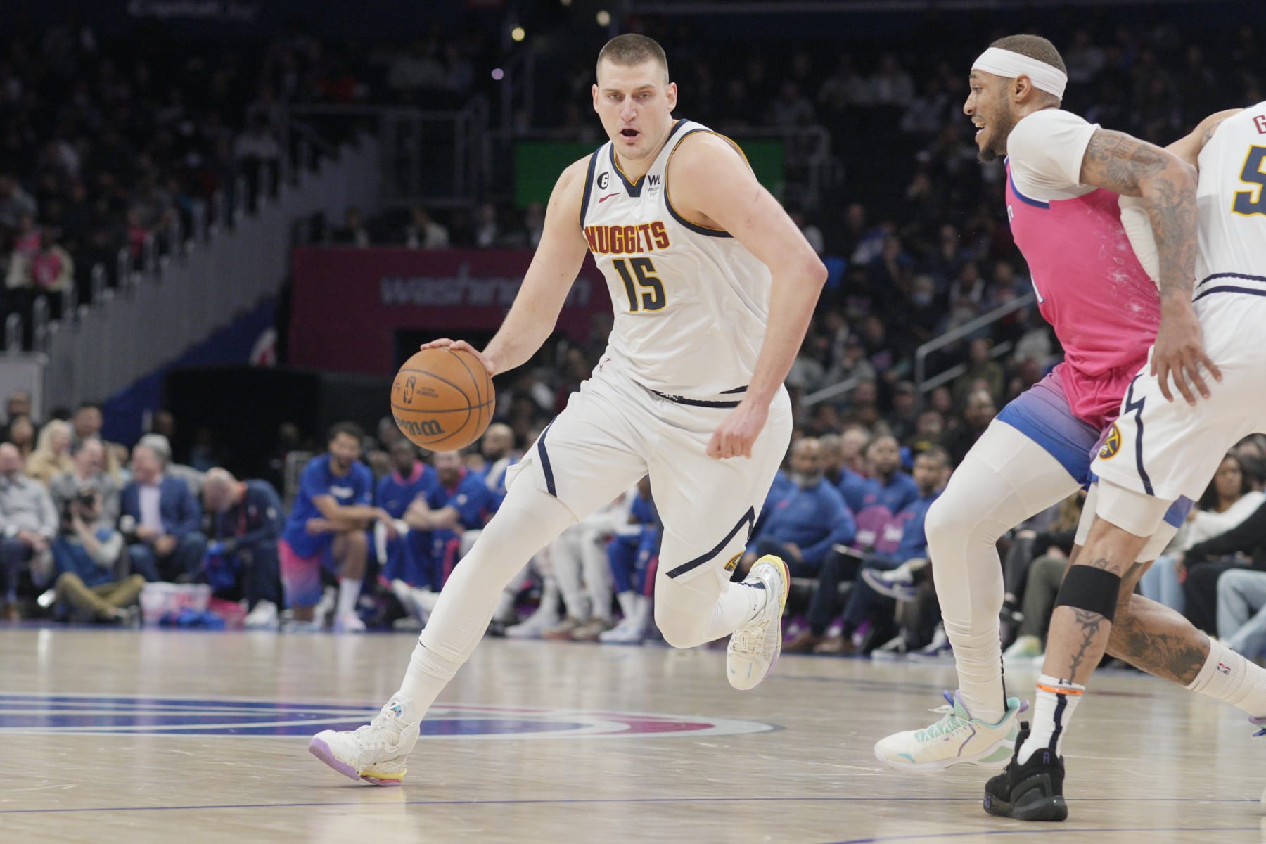 WASHINGTON, DC - MARCH 22: Nikola Jokic #15 of the Denver Nuggets drives against Daniel Gafford #21 of the Washington Wizards during the first half at Capital One Arena on March 22, 2023 in Washington, DC. NOTE TO USER: User expressly acknowledges and agrees that, by downloading and or using this photograph, User is consenting to the terms and conditions of the Getty Images License Agreement. (Photo by Jess Rapfogel/Getty Images)