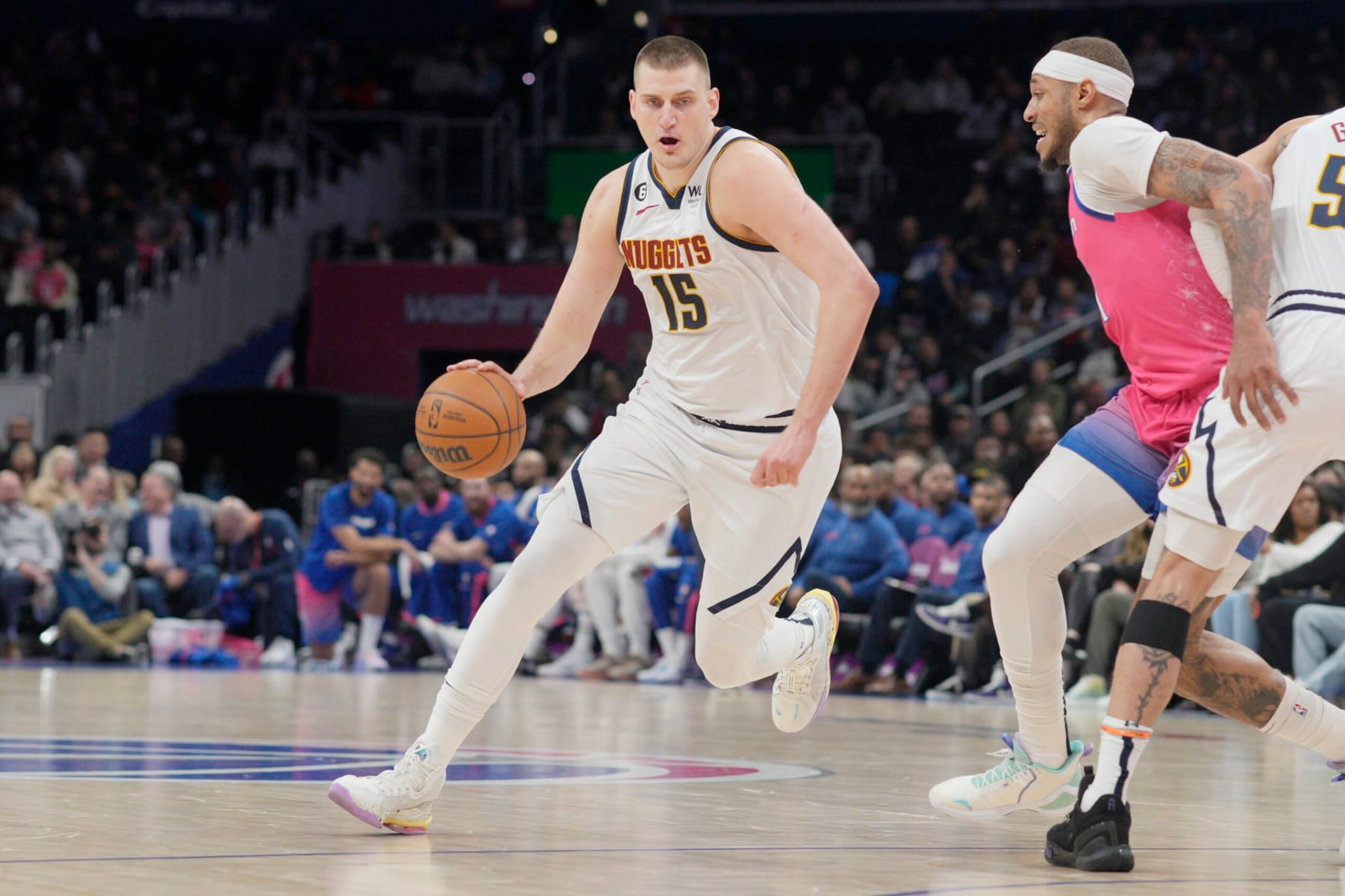 WASHINGTON, DC - MARCH 22: Nikola Jokic #15 of the Denver Nuggets drives against Daniel Gafford #21 of the Washington Wizards during the first half at Capital One Arena on March 22, 2023 in Washington, DC. NOTE TO USER: User expressly acknowledges and agrees that, by downloading and or using this photograph, User is consenting to the terms and conditions of the Getty Images License Agreement. (Photo by Jess Rapfogel/Getty Images)
