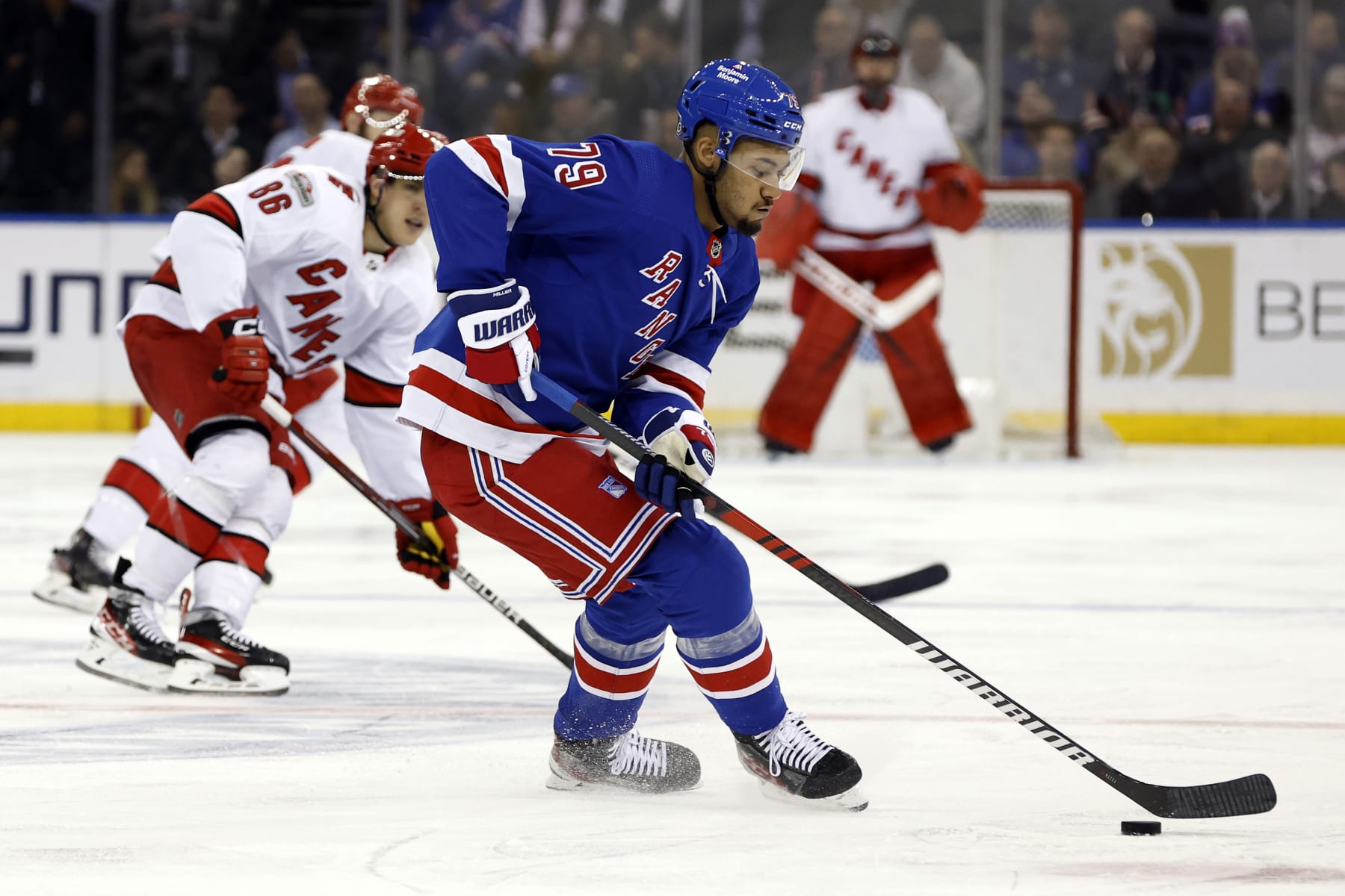 NEW YORK, NEW YORK - MARCH 21: K'Andre Miller #79 of the New York Rangers controls the puck during the third period against the Carolina Hurricanes at Madison Square Garden on March 21, 2023 in New York City. The Hurricanes won 3-2. (Photo by Sarah Stier/Getty Images)