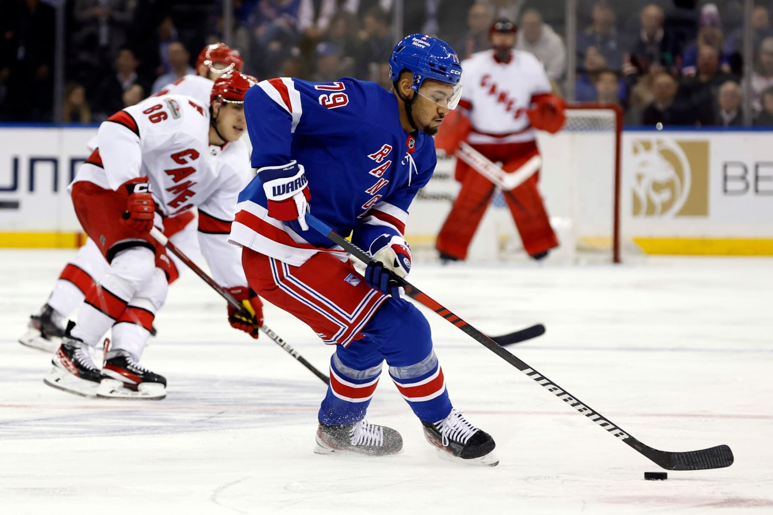NEW YORK, NEW YORK - MARCH 21: K'Andre Miller #79 of the New York Rangers controls the puck during the third period against the Carolina Hurricanes at Madison Square Garden on March 21, 2023 in New York City. The Hurricanes won 3-2. (Photo by Sarah Stier/Getty Images)
