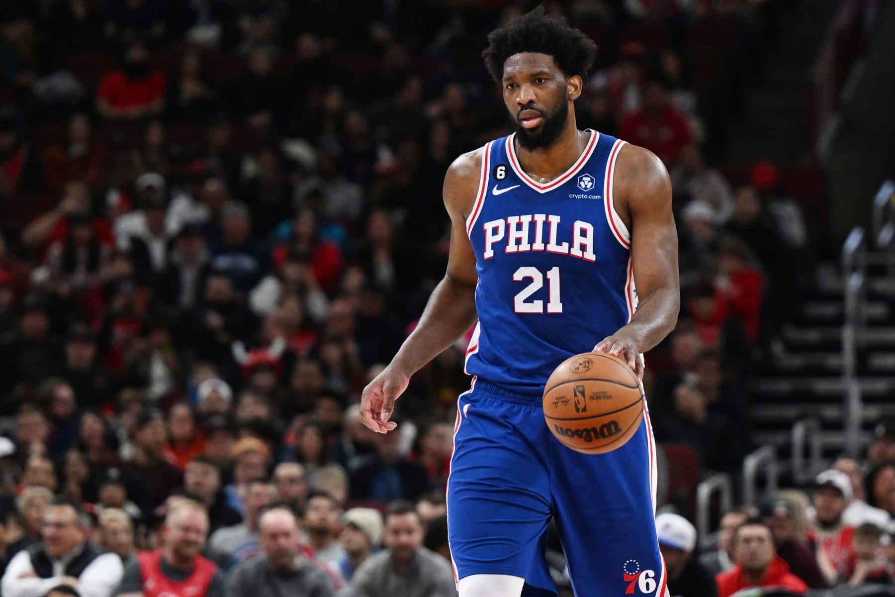 CHICAGO, ILLINOIS - MARCH 22: Joel Embiid #21 of the Philadelphia 76ers handles the basketball in the first half against the Chicago Bulls at United Center on March 22, 2023 in Chicago, Illinois.  NOTE TO USER: User expressly acknowledges and agrees that, by downloading and or using this photograph, User is consenting to the terms and conditions of the Getty Images License Agreement.  (Photo by Quinn Harris/Getty Images)