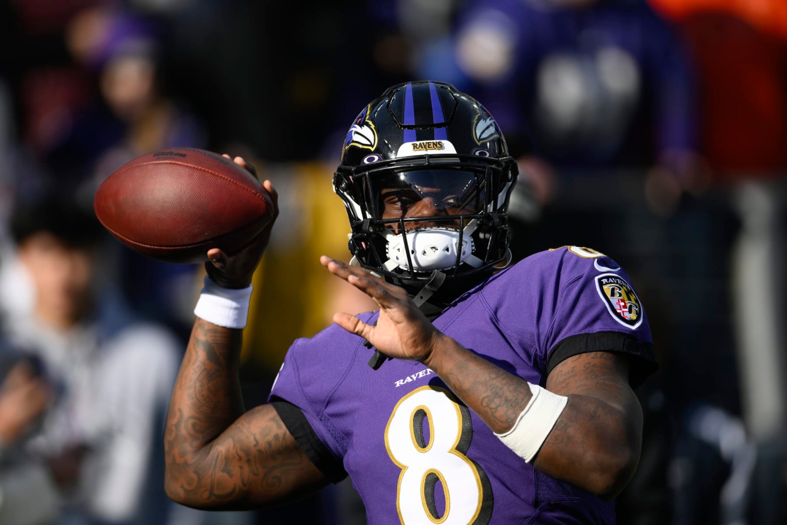 Baltimore Ravens quarterback Lamar Jackson (8) looks to pass during warm-ups ahead of an NFL football game against the Denver Broncos, Sunday, Dec. 4, 2022, in Baltimore. (AP Photo/Nick Wass)