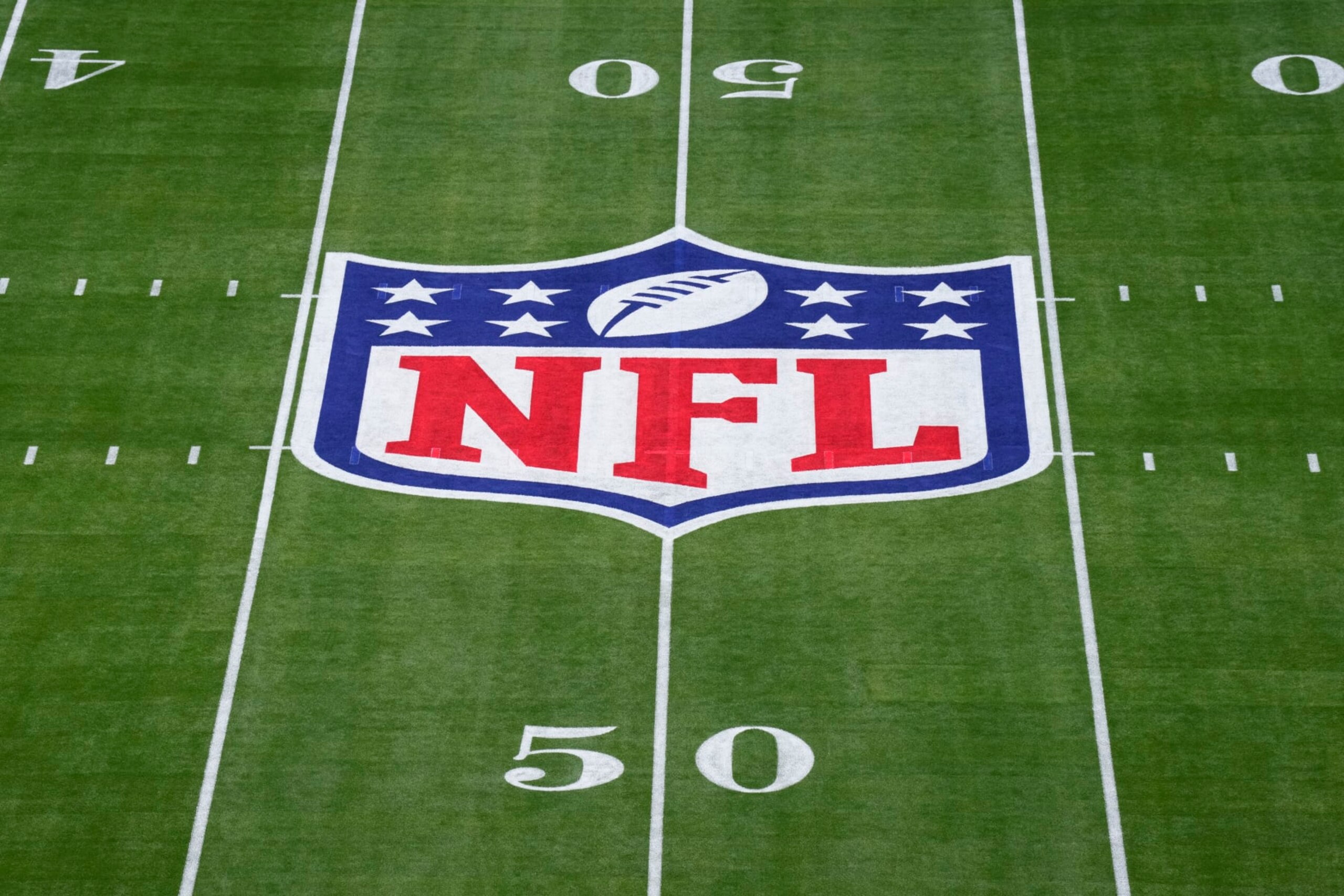 GLENDALE, AZ - FEBRUARY 12: Elevated view of the NFL Shield logo painted on the field prior to Super Bowl LVII between the Kansas City Chiefs and the Philadelphia Eagles at State Farm Stadium on February 12, 2023 in Glendale, Arizona. (Photo by Cooper Neill/Getty Images)