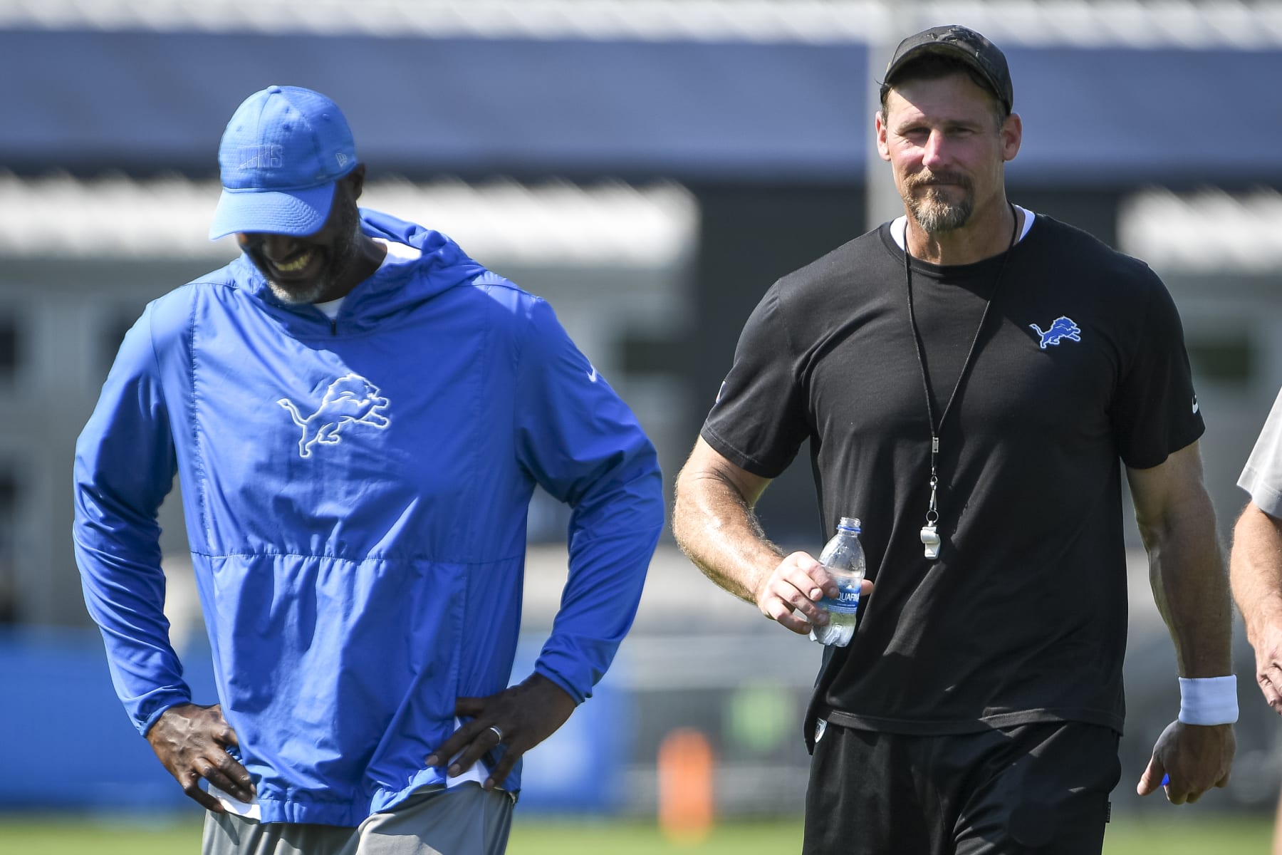 ALLEN PARK, MICHIGAN - JULY 28: Detroit Lions general manager Brad Holmes (L) and head football coach Dan Campbell talk after the Detroit Lions Training Camp on July 28, 2021 in Allen Park, Michigan. (Photo by Nic Antaya/Getty Images)