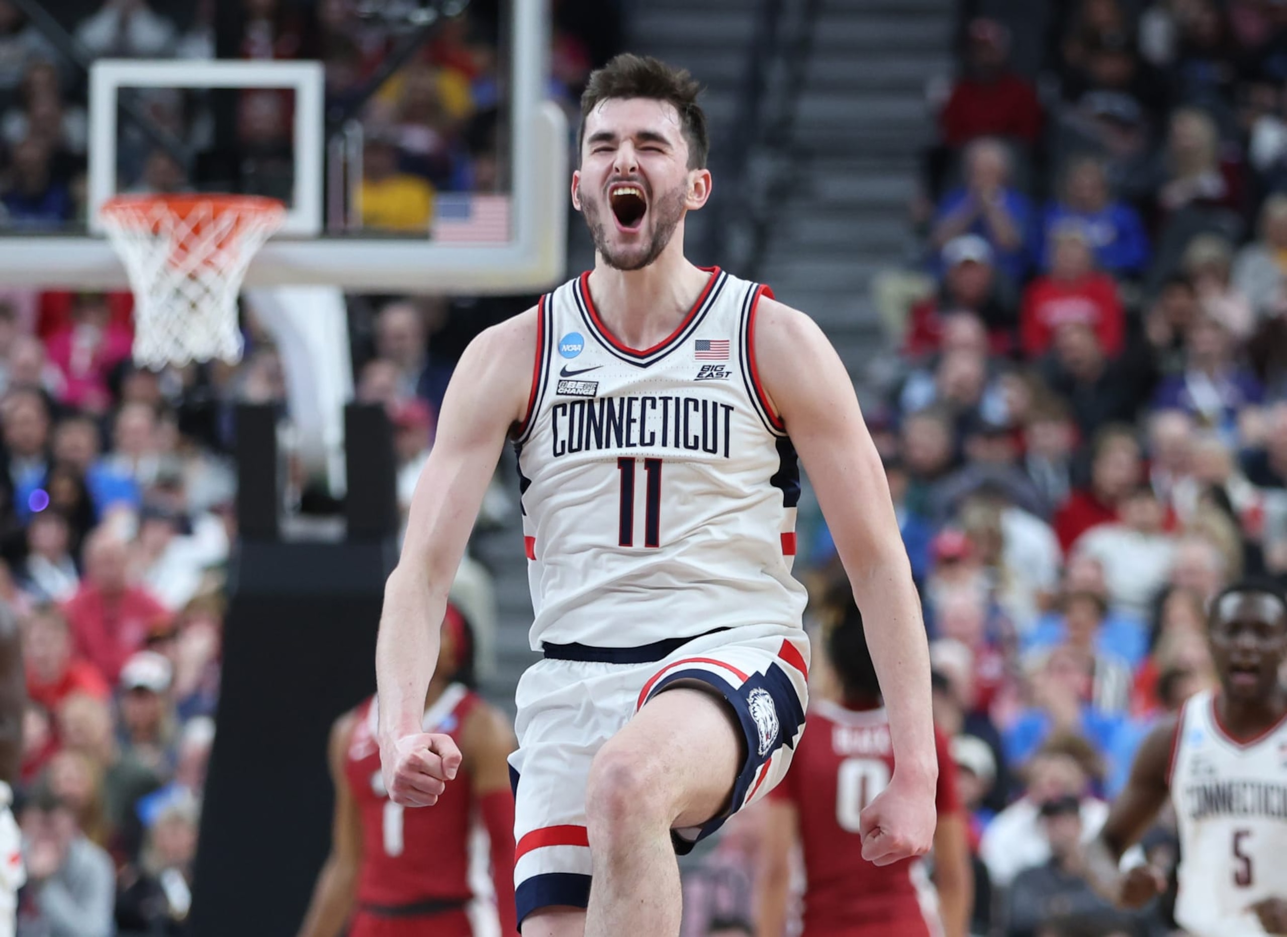 LAS VEGAS, NEVADA - MARCH 23: Alex Karaban #11 of the Connecticut Huskies reacts after a score during the first half against the Arkansas Razorbacks in the Sweet 16 round of the NCAA Men's Basketball Tournament at T-Mobile Arena on March 23, 2023 in Las Vegas, Nevada. (Photo by Sean M. Haffey/Getty Images)