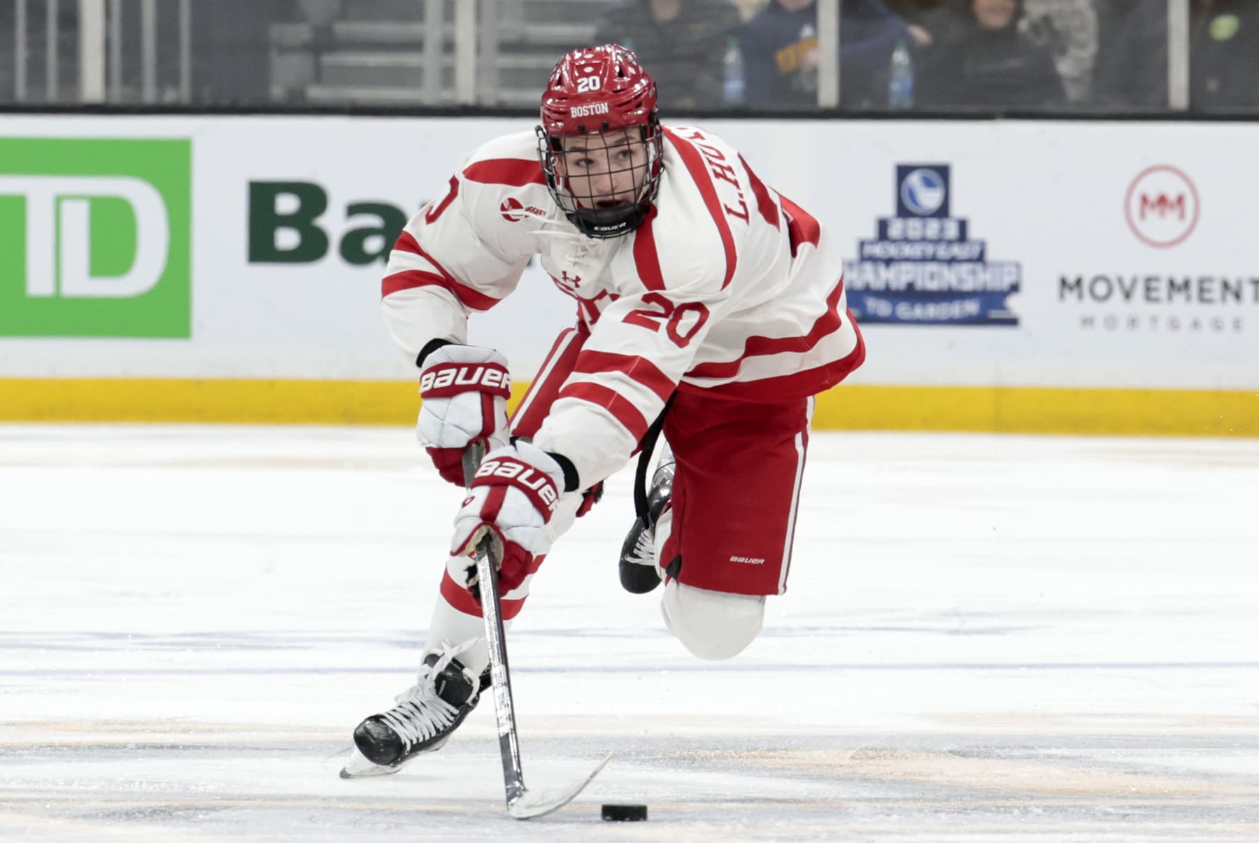 BOSTON, MA - MARCH 18: Boston University Terriers defenseman Lane Hutson (20) carries the puck during the Hockey East Championship game between the Boston University Terriers and the Merrimack College Warriors on March 18, 2023, at TD Garden in Boston, Massachusetts. (Photo by Fred Kfoury III/Icon Sportswire via Getty Images)