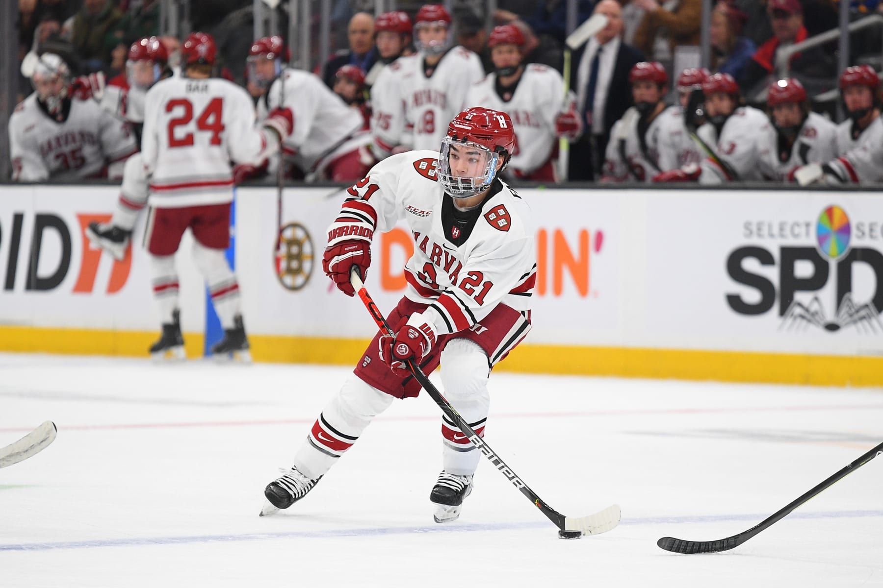 BOSTON, MA - FEBRUARY 06: Harvard Crimson forward Sean Farrell (21) skates with the puck during a Dunkin' Beanpot semifinal game between the Boston College Eagles and the Harvard Crimson on February 6, 2023, at TD Garden in Boston, MA. (Photo by Erica Denhoff/Icon Sportswire via Getty Images)