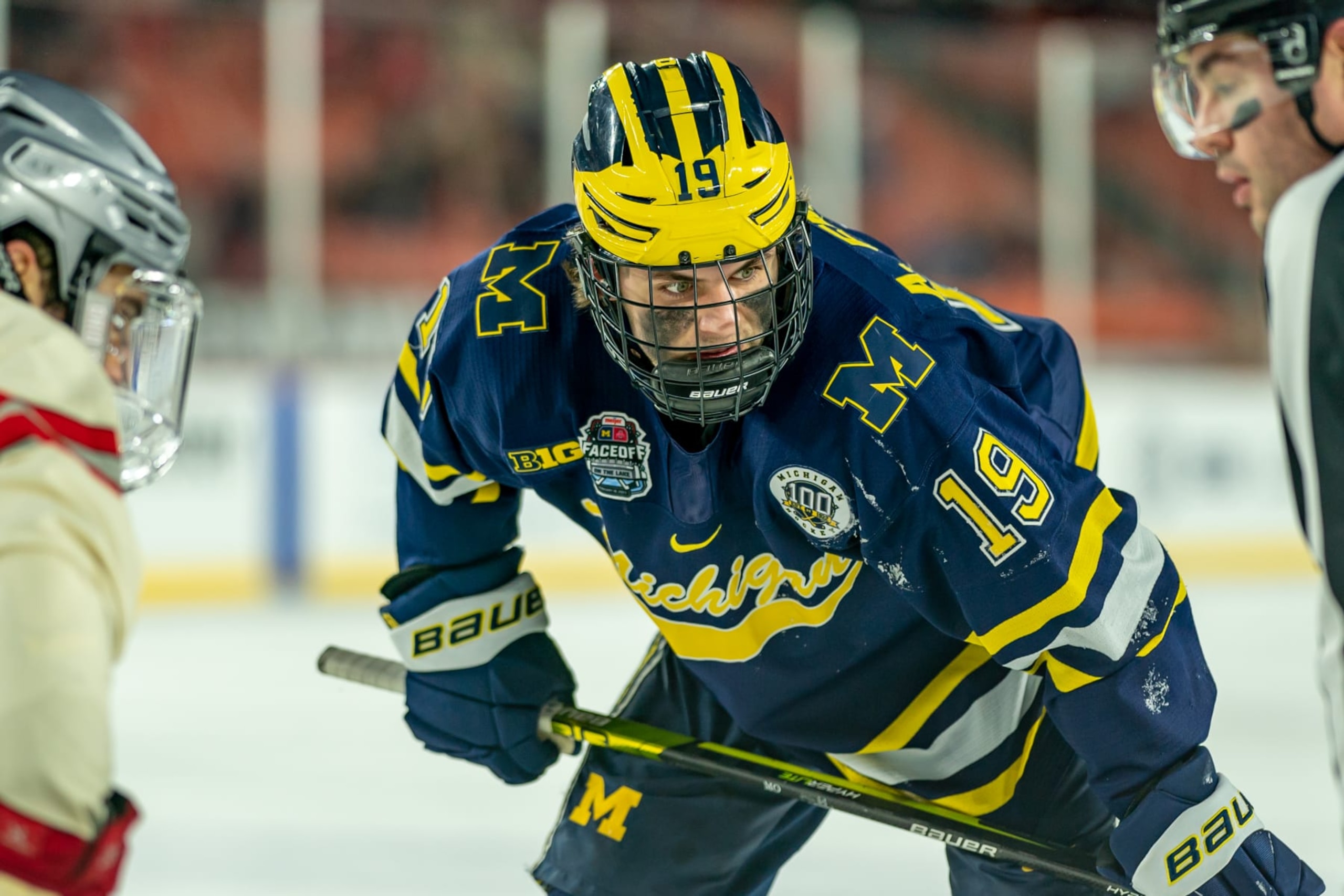 CLEVELAND, OH  FEBRUARY 18: Adam Fantilli #19 of the Michigan Wolverines waits for the puck drop against the Ohio State Buckeyes during the third period of the Faceoff on the Lake NCAA ice hockey game at FirstEnergy Stadium on February 18, 2023 in Cleveland, OH. Ohio State won the game with a final score of 4-2. (Photo by Jaime Crawford/Getty Images)