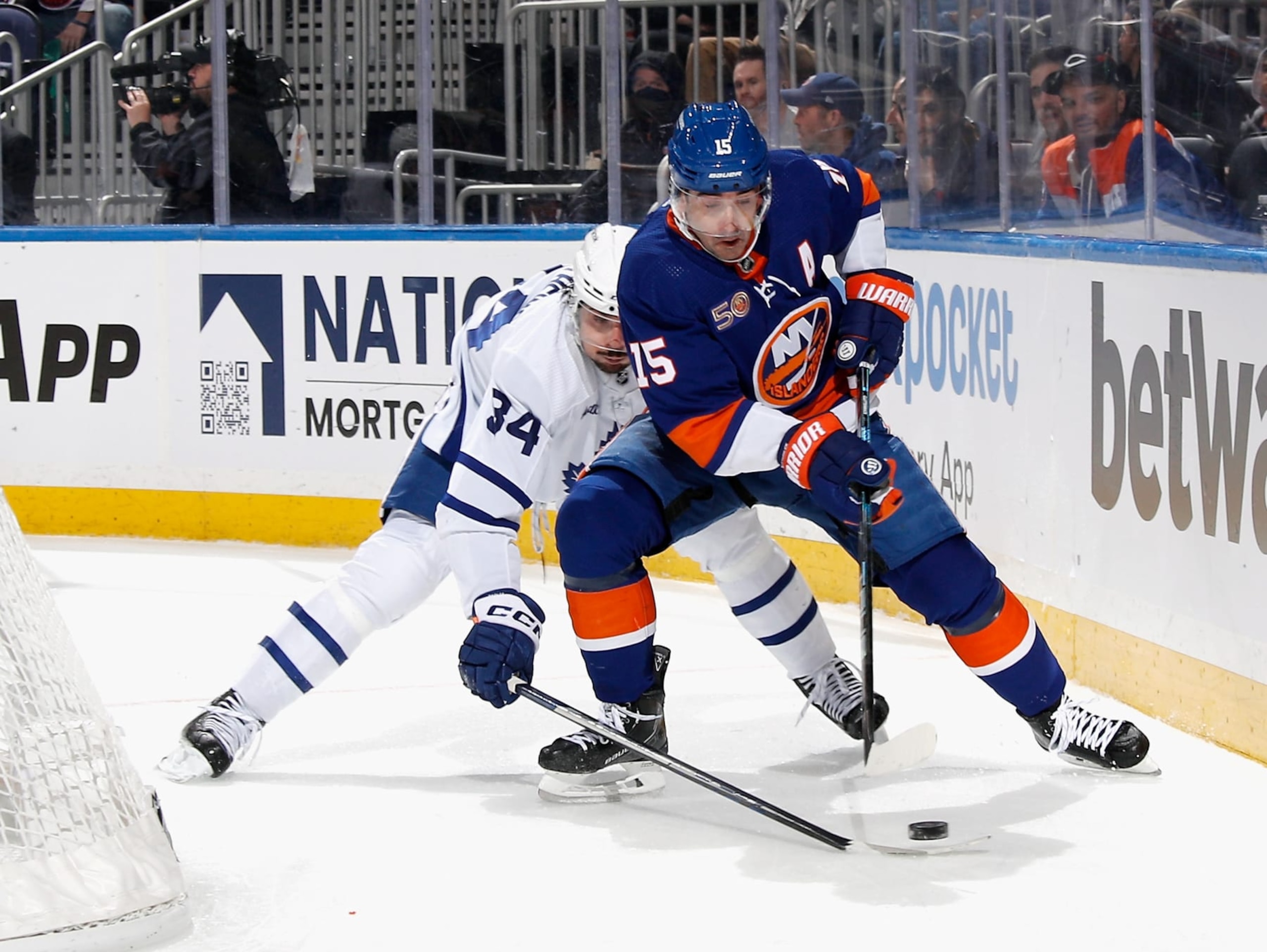 ELMONT, NEW YORK - MARCH 21: Cal Clutterbuck #15 of the New York Islanders skates against the Toronto Maple Leafs at the UBS Arena on March 21, 2023 in Elmont, New York. (Photo by Bruce Bennett/Getty Images)