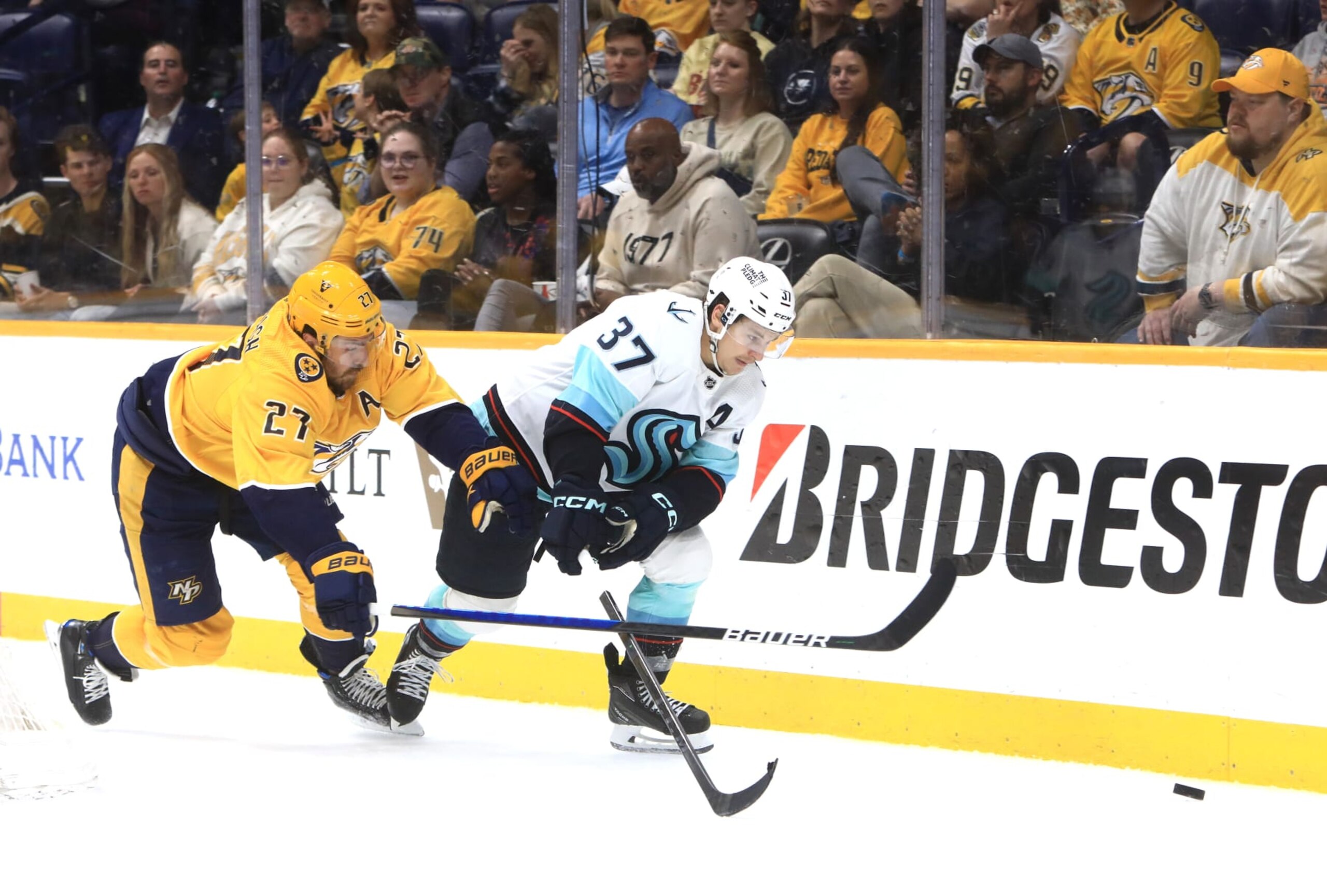 NASHVILLE, TN - MARCH 23: Nashville Predators defenseman Ryan McDonagh (27) defends against Seattle Kraken center Yanni Gourde (37) during the NHL game between the Nashville Predators and Seattle Kraken, held on March 23, 2023, at Bridgestone Arena in Nashville, Tennessee. (Photo by Danny Murphy/Icon Sportswire via Getty Images)