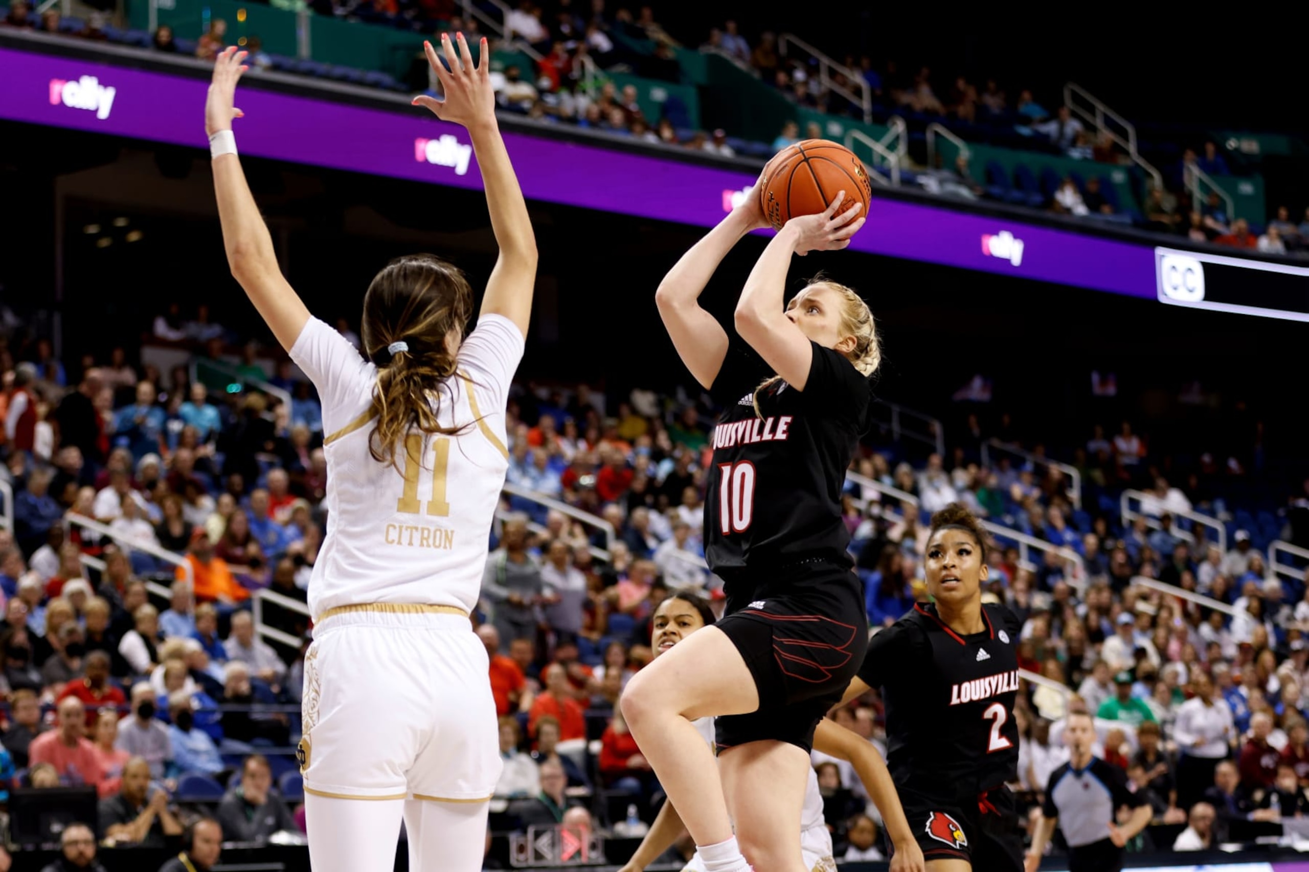 GREENSBORO, NC - MARCH 04: Hailey Van Lith #10 of the Louisville Cardinals puts up a shot against Sonia Citron #11 of the Notre Dame Fighting Irish during the first half of their game in the semifinals of the ACC Women's Basketball Tournament at Greensboro Coliseum on March 4, 2023 in Greensboro, North Carolina. (Photo by Lance King/Getty Images)