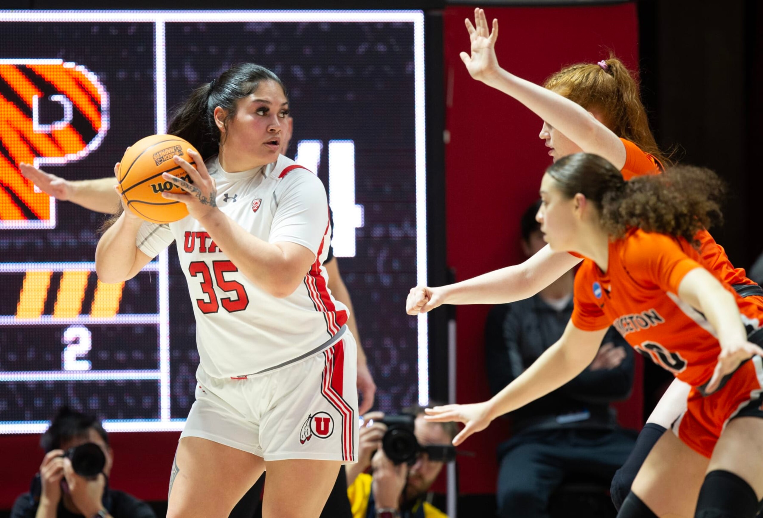 SALT LAKE CITY, UT- MARCH 19: Alissa Pili #35 of the Utah Utes is pressured by Grace Stone #10 and Parker Hill #22 of the Princeton Tigers during the first half of the second round of the NCAA Womens Basketball Tournament at the John M Huntsman Center March 19, 2023 in Salt Lake City, Utah.(Photo by Chris Gardner/Getty Images)