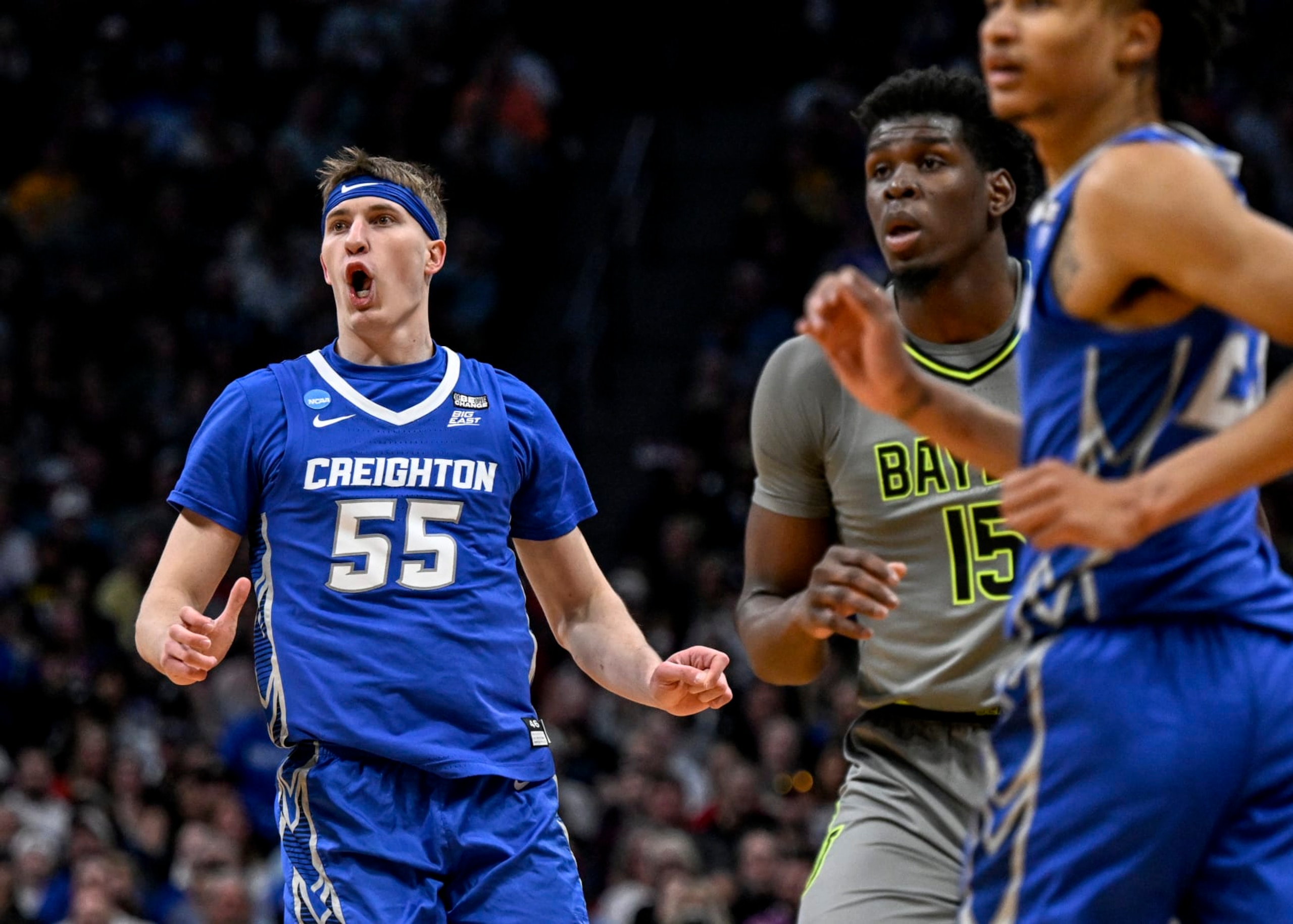DENVER, CO - MARCH 19: Baylor Scheierman (55) of the Creighton Bluejays watches after shooting over Josh Ojianwuna (15) of the Baylor Bears during the second half of Creightons 85-76 second round NCAA mens basketball tournament win at Ball Arena in Denver on Sunday, March 19, 2023. (Photo by AAron Ontiveroz/MediaNews Group/The Denver Post via Getty Images)