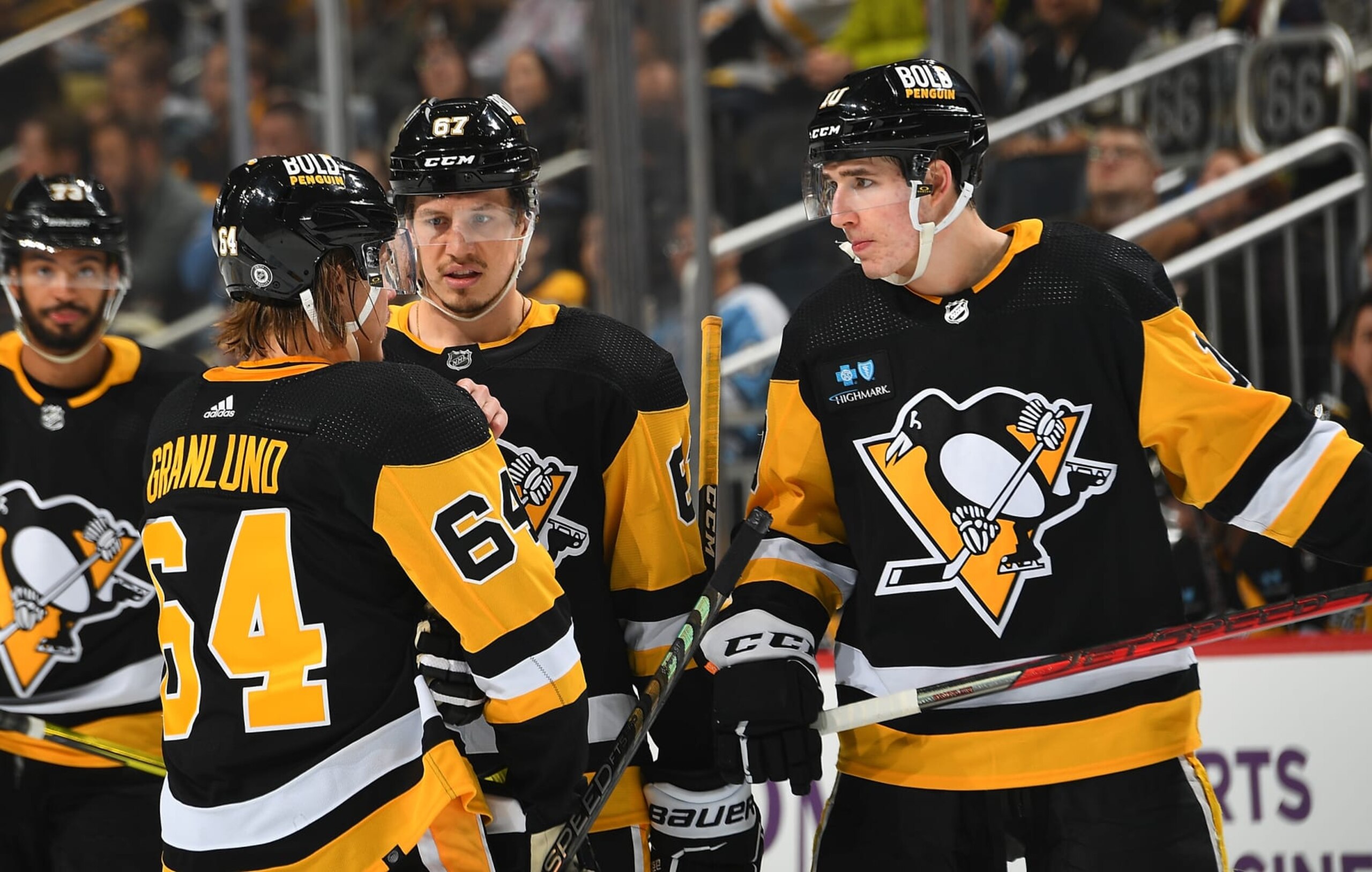 PITTSBURGH, PA - MARCH 14:  Mikael Granlund #64 talks with Rickard Rakell #67 and Drew O'Connor #10 of the Pittsburgh Penguins during the game against the Montreal Canadiens at PPG PAINTS Arena on March 14, 2023 in Pittsburgh, Pennsylvania. (Photo by Joe Sargent/NHLI via Getty Images)