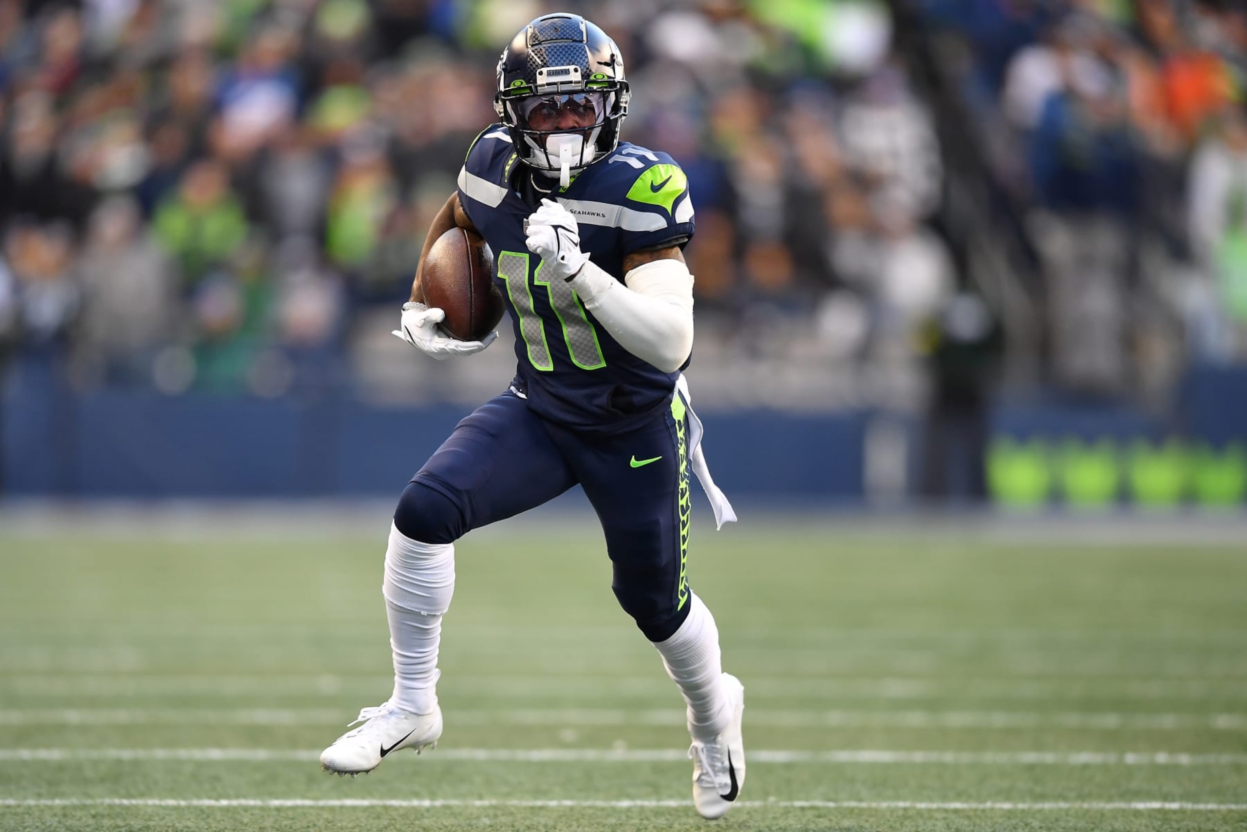 SEATTLE, WASHINGTON - NOVEMBER 27: Marquise Goodwin #11 of the Seattle Seahawks runs with the ball in the fourth quarter against the Las Vegas Raiders at Lumen Field on November 27, 2022 in Seattle, Washington. (Photo by Jane Gershovich/Getty Images)
