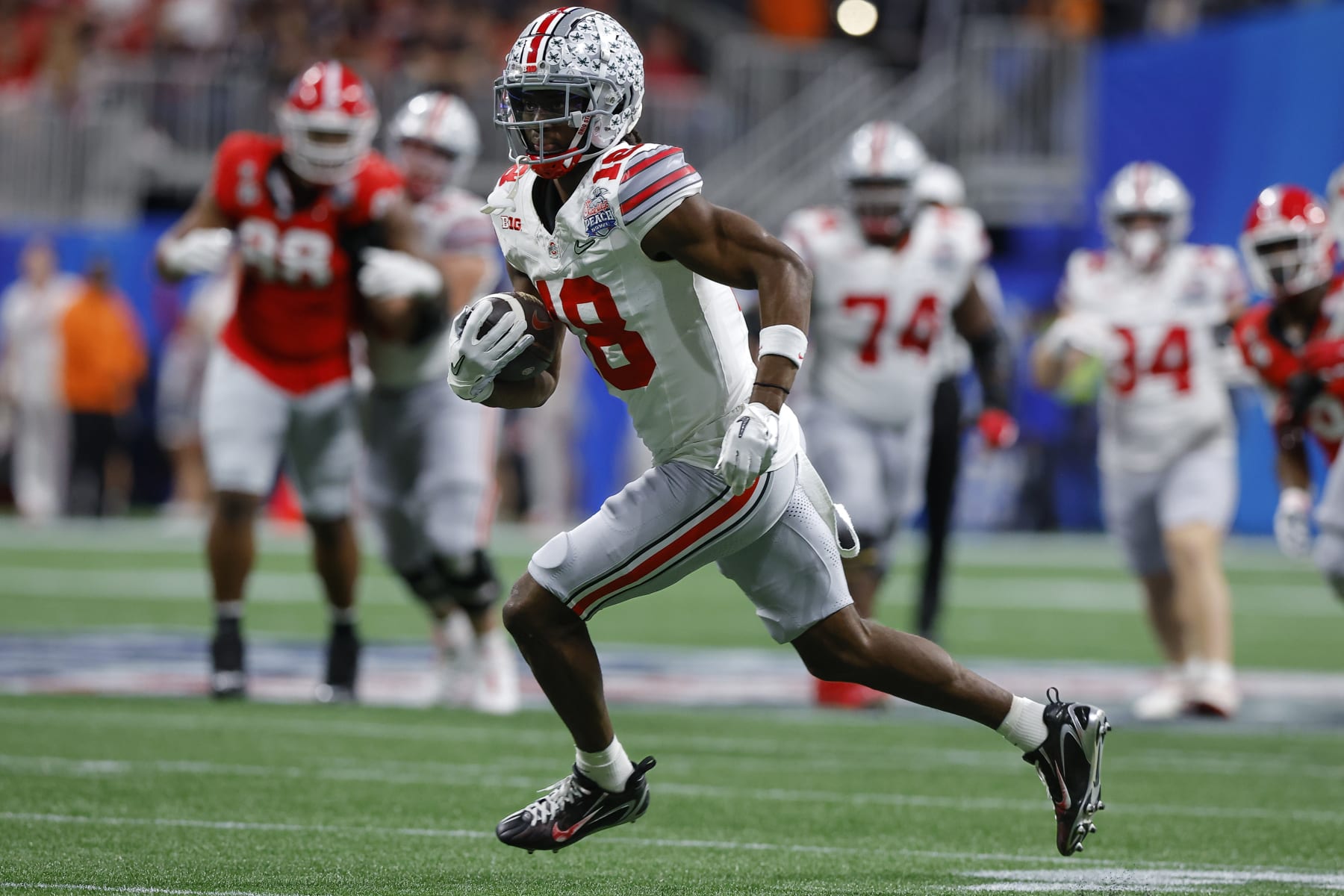 Marvin Harrison rushes after a reception against the Georgia Bulldogs in the Chick-fil-A Peach Bowl on December 31, 2022.
