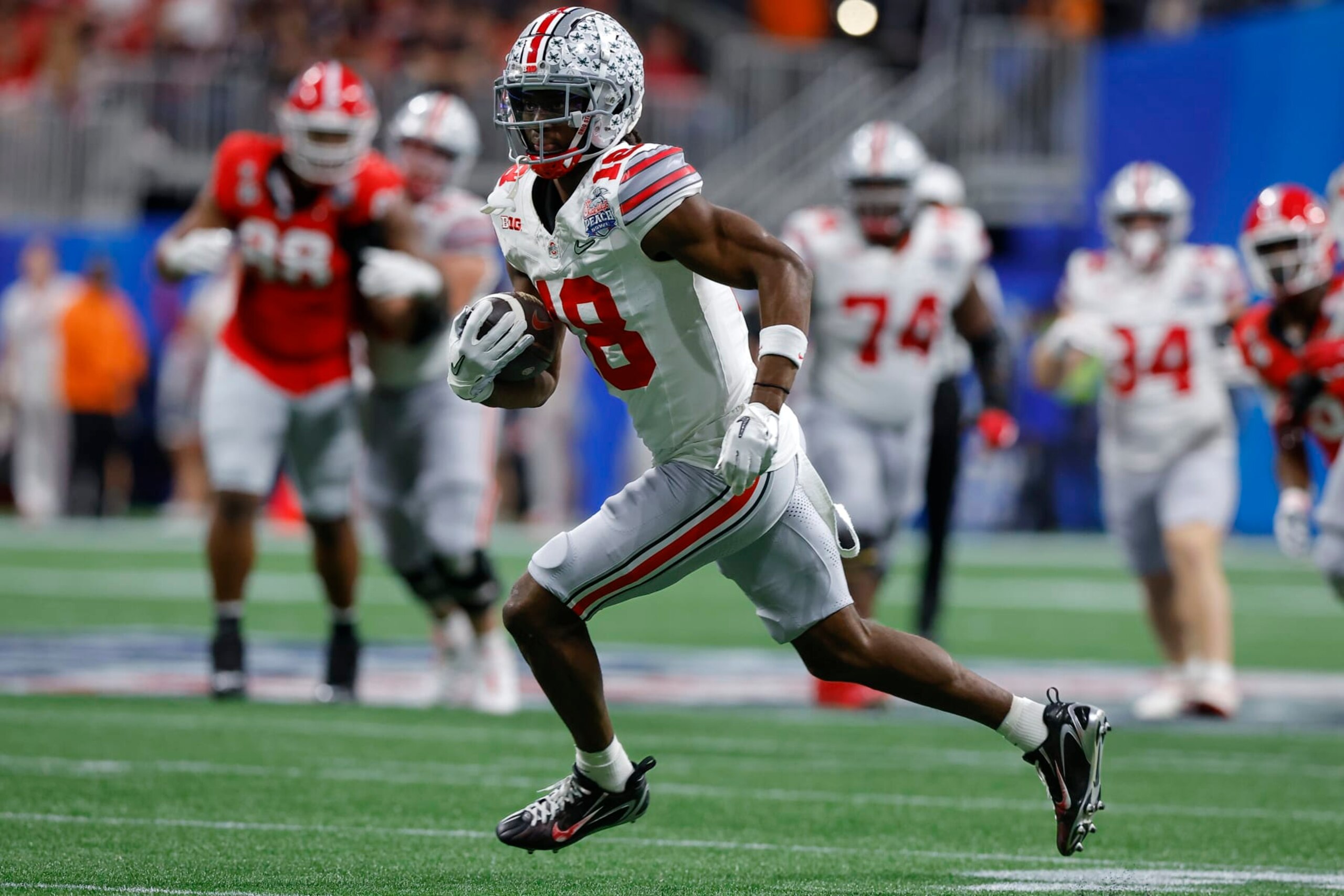 Marvin Harrison rushes after a reception against the Georgia Bulldogs in the Chick-fil-A Peach Bowl on December 31, 2022.