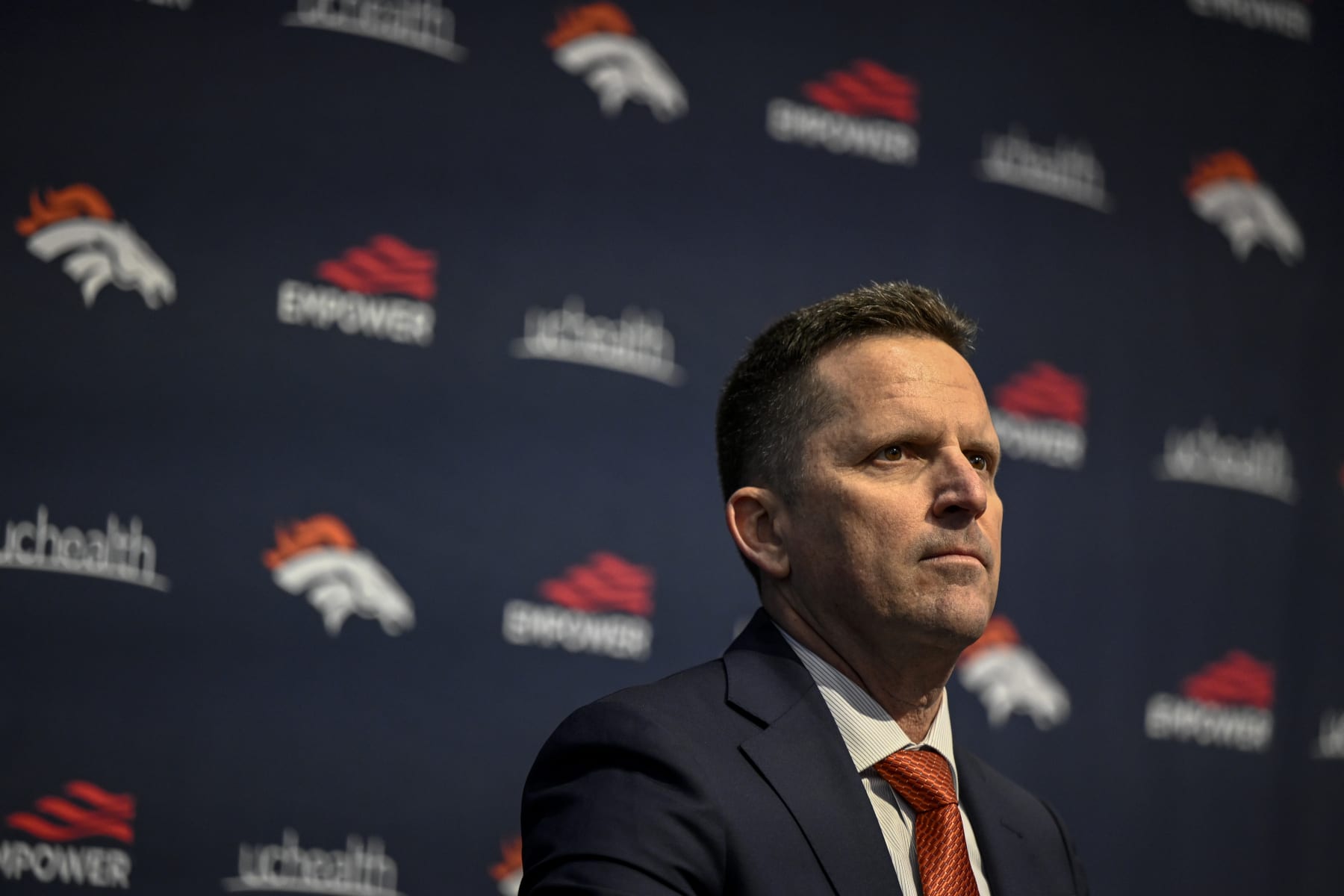 ENGLEWOOD , CO - FEBRUARY 6: General manager George Paton listens as Denver Broncos head coach Sean Payton is hyped by owner Greg Penner during an introductory press conference at team headquarters in Englewood, Colorado on Monday, February 6, 2023. (Photo by AAron Ontiveroz/MediaNews Group/The Denver Post via Getty Images)