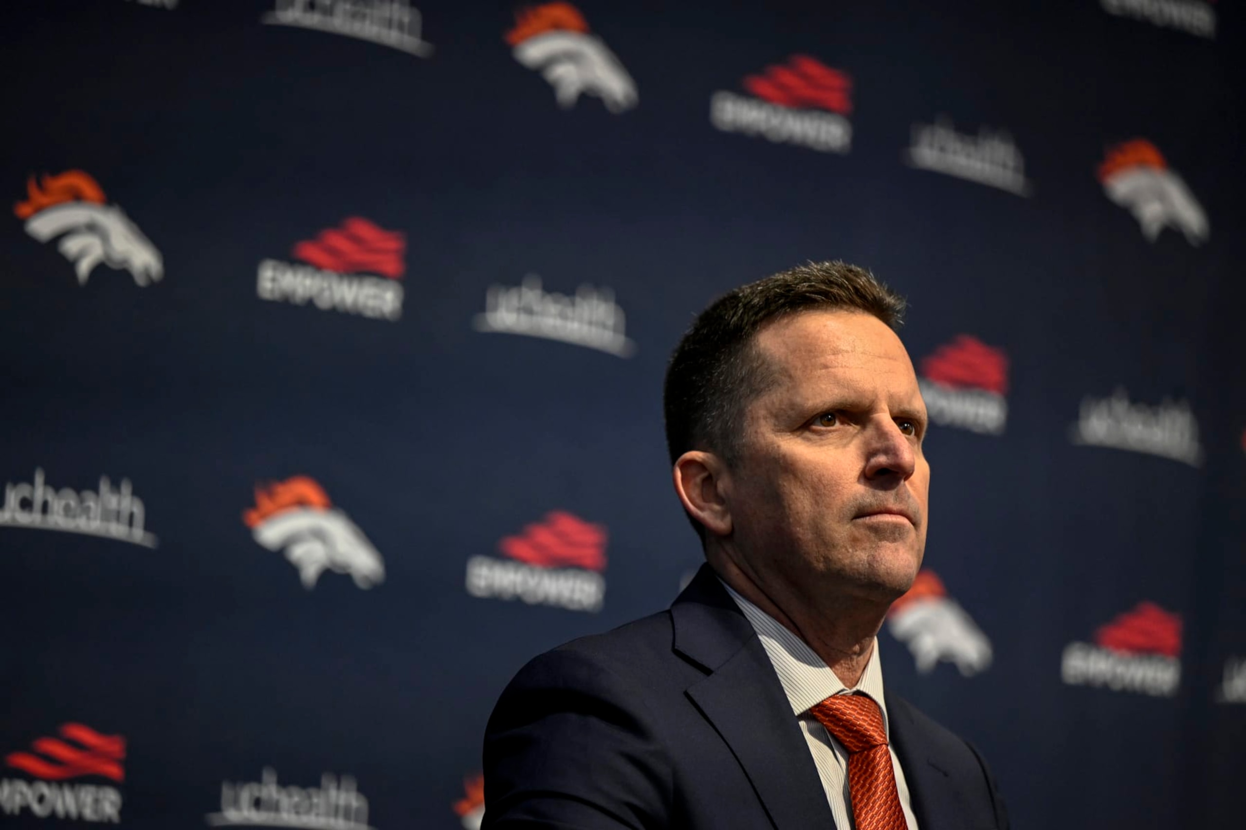 ENGLEWOOD , CO - FEBRUARY 6: General manager George Paton listens as Denver Broncos head coach Sean Payton is hyped by owner Greg Penner during an introductory press conference at team headquarters in Englewood, Colorado on Monday, February 6, 2023. (Photo by AAron Ontiveroz/MediaNews Group/The Denver Post via Getty Images)