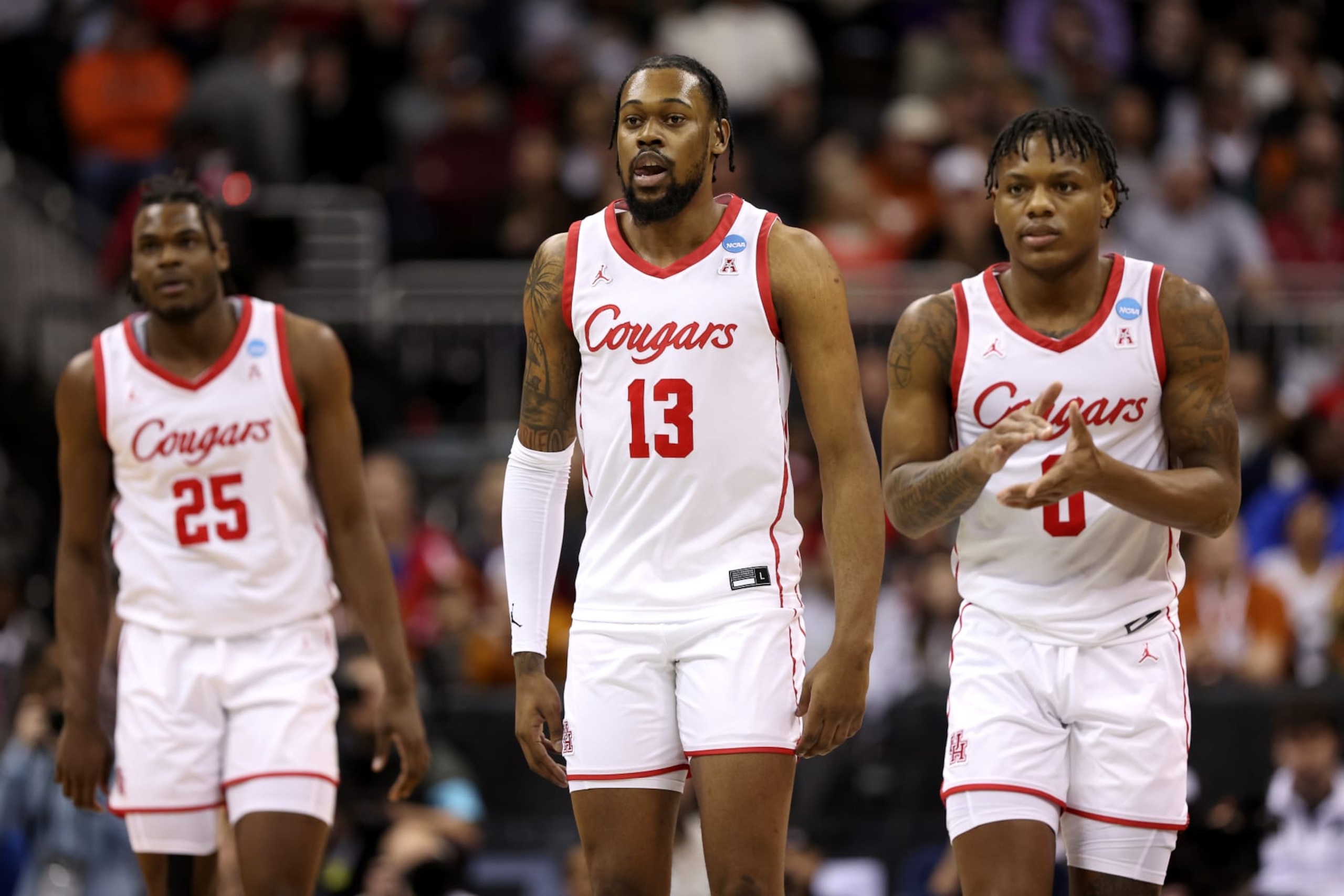 KANSAS CITY, MISSOURI - MARCH 24: Jarace Walker #25, J'Wan Roberts #13 and Marcus Sasser #0 of the Houston Cougars look on during the first half against the Miami Hurricanes in the Sweet 16 round of the NCAA Men's Basketball Tournament at T-Mobile Center on March 24, 2023 in Kansas City, Missouri. (Photo by Jamie Squire/Getty Images)