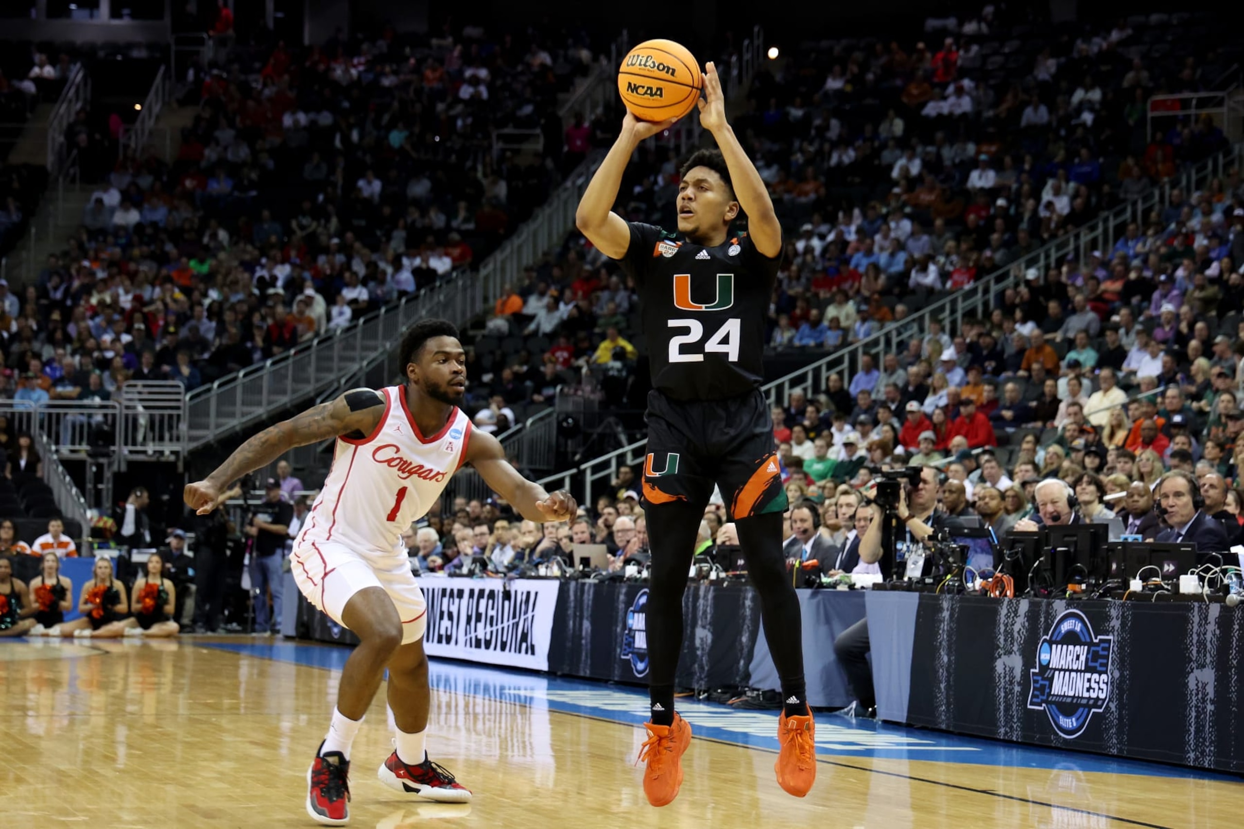 KANSAS CITY, MISSOURI - MARCH 24: Nijel Pack #24 of the Miami Hurricanes shoots the ball against Jamal Shead #1 of the Houston Cougars during the first half in the Sweet 16 round of the NCAA Men's Basketball Tournament at T-Mobile Center on March 24, 2023 in Kansas City, Missouri. (Photo by Gregory Shamus/Getty Images)
