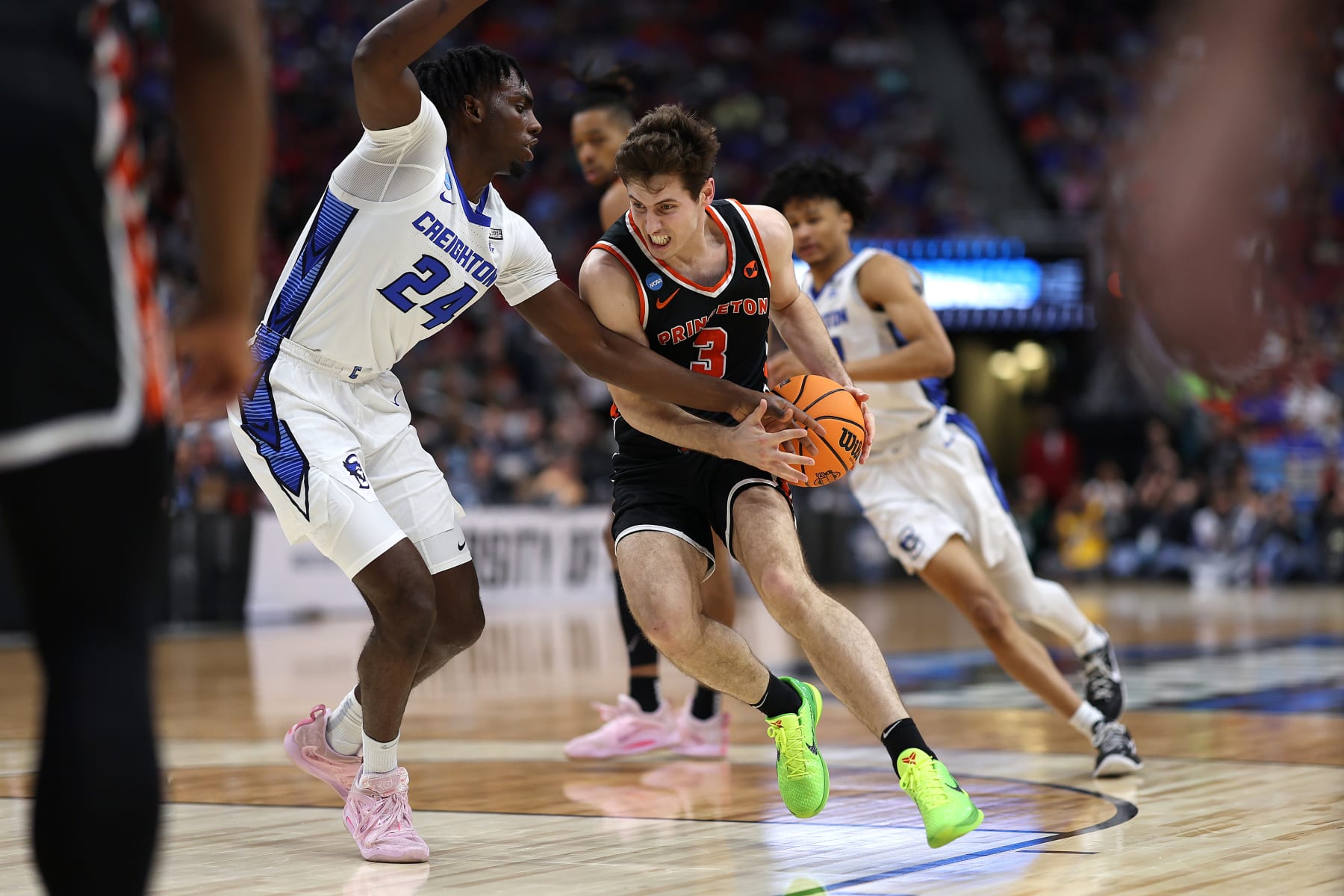 LOUISVILLE, KENTUCKY - MARCH 24: Ryan Langborg #3 of the Princeton Tigers drives against Arthur Kaluma #24 of the Creighton Bluejays during the second half in the Sweet 16 round of the NCAA Men's Basketball Tournament at KFC YUM! Center on March 24, 2023 in Louisville, Kentucky. (Photo by Rob Carr/Getty Images)