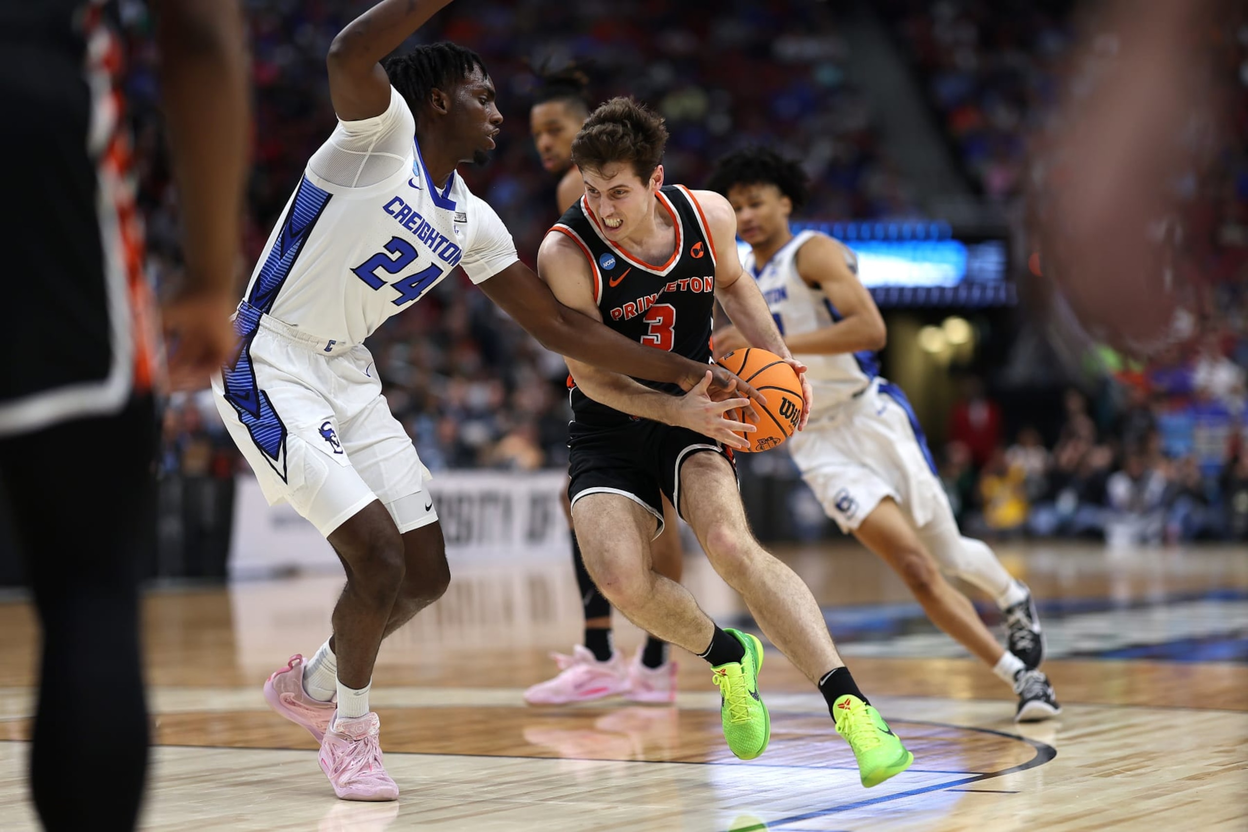 LOUISVILLE, KENTUCKY - MARCH 24: Ryan Langborg #3 of the Princeton Tigers drives against Arthur Kaluma #24 of the Creighton Bluejays during the second half in the Sweet 16 round of the NCAA Men's Basketball Tournament at KFC YUM! Center on March 24, 2023 in Louisville, Kentucky. (Photo by Rob Carr/Getty Images)