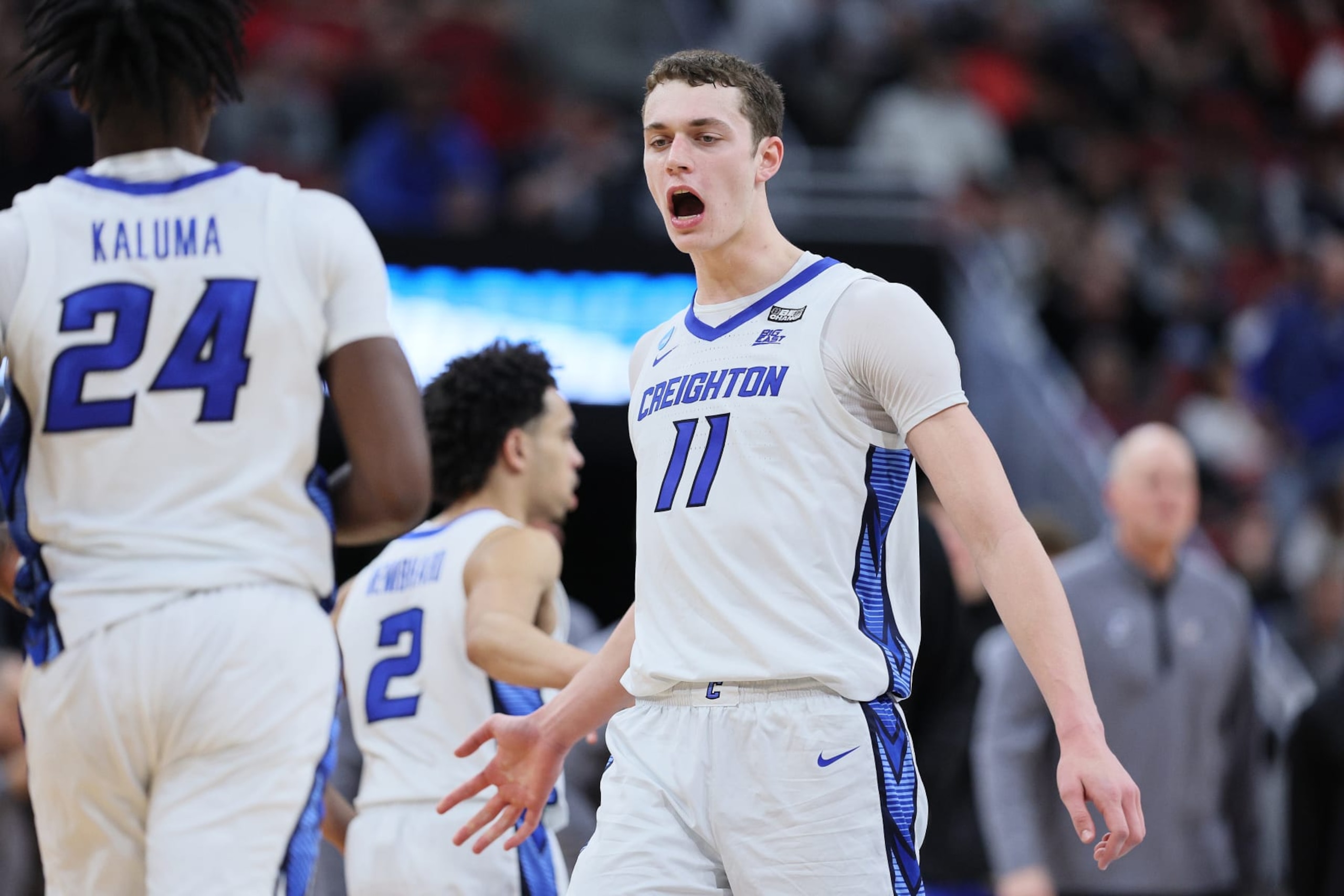 LOUISVILLE, KENTUCKY - MARCH 24: Ryan Kalkbrenner #11 of the Creighton Bluejays reacts with Arthur Kaluma #24 of the Creighton Bluejays during the first half in the Sweet 16 round of the NCAA Men's Basketball Tournament at KFC YUM! Center against the Princeton Tigers on March 24, 2023 in Louisville, Kentucky. (Photo by Andy Lyons/Getty Images)