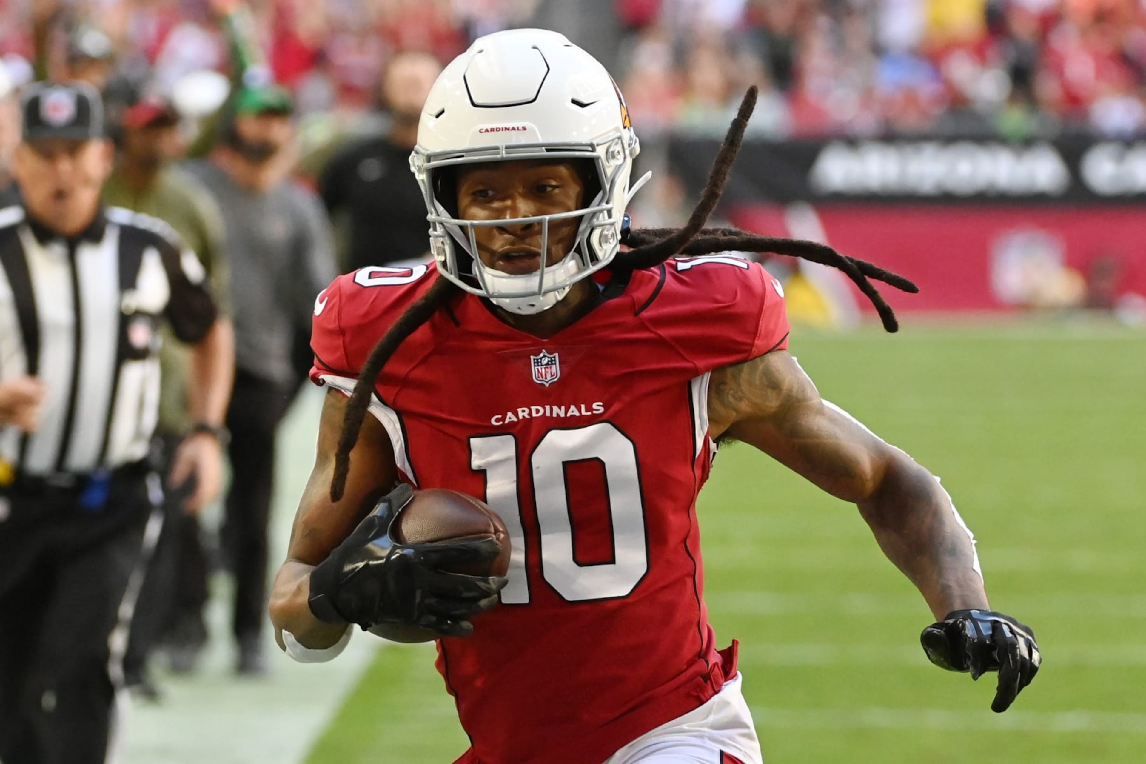GLENDALE, ARIZONA - NOVEMBER 06: DeAndre Hopkins #10 of the Arizona Cardinals catches a pass and runs for a touchdown during the first quarter against the Seattle Seahawks at State Farm Stadium on November 06, 2022 in Glendale, Arizona. (Photo by Norm Hall/Getty Images) GLENDALE, ARIZONA - NOVEMBER 06: DeAndre Hopkins #10 of the Arizona Cardinals catches a pass and runs for a touchdown during the first quarter against the Seattle Seahawks at State Farm Stadium on November 06, 2022 in Glendale, Arizona. (Photo by Norm Hall/Getty Images)