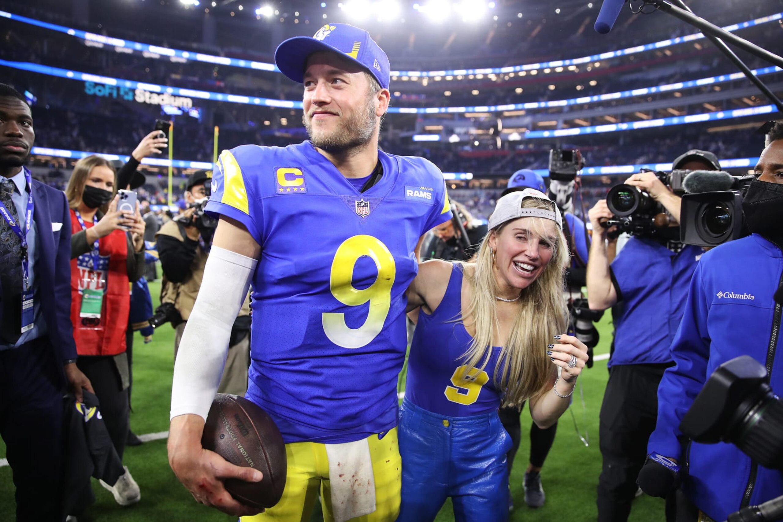 INGLEWOOD, CALIFORNIA - JANUARY 30: Matthew Stafford #9 of the Los Angeles Rams and wife Kelly Hall react after defeating the San Francisco 49ers in the NFC Championship Game at SoFi Stadium on January 30, 2022 in Inglewood, California. The Rams defeated the 49ers 20-17. (Photo by Christian Petersen/Getty Images)